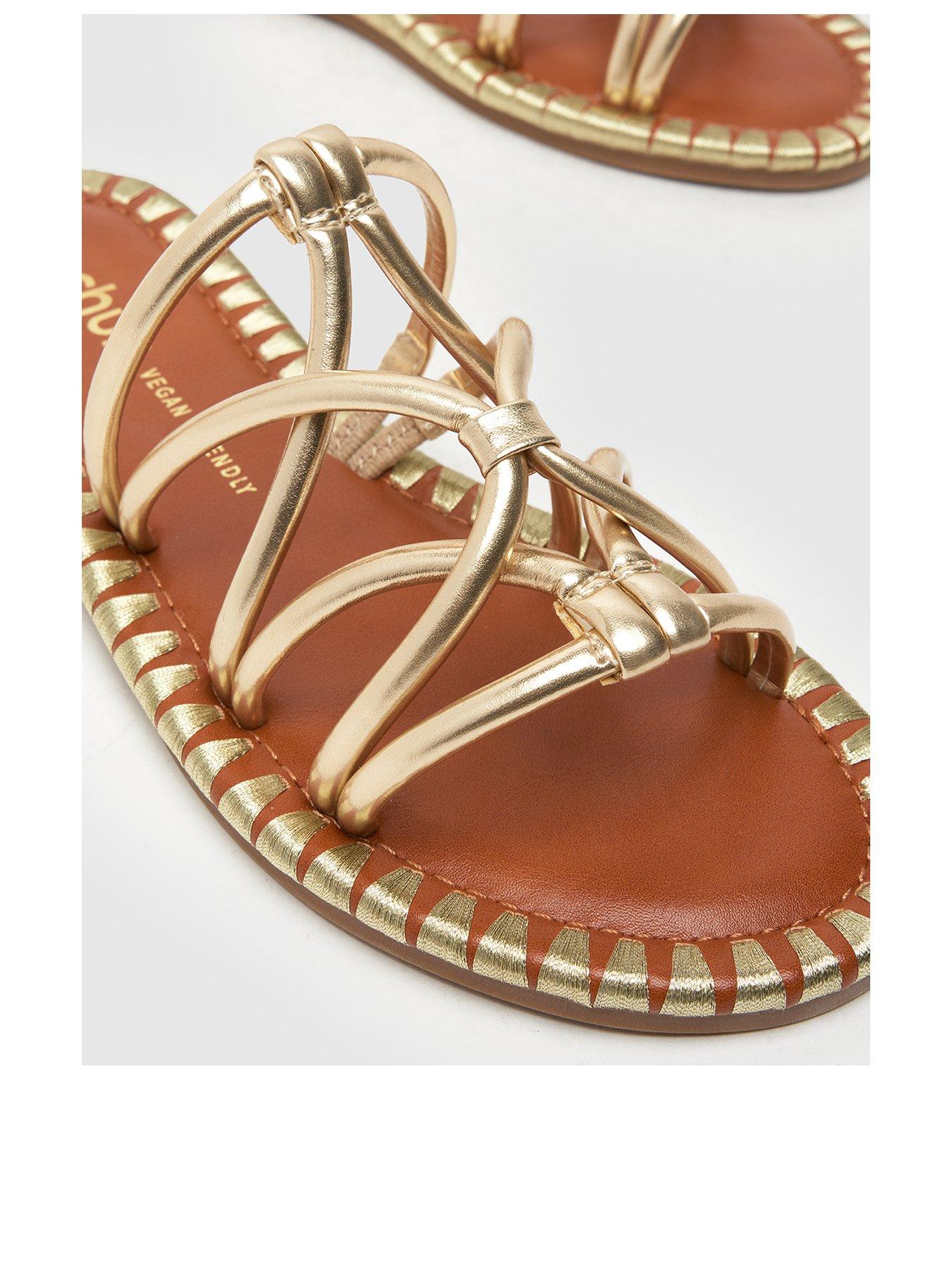schuh-tevin-feature-rand-flat-sandals-goldback