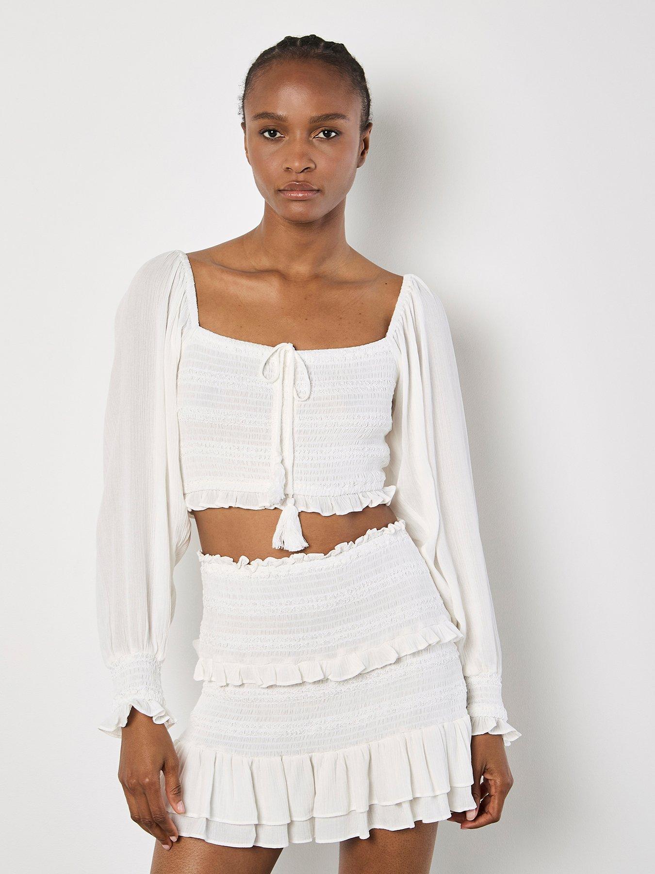 Image 1 of 5 of Apricot Smocked Tassle Crop L/sleeve Top