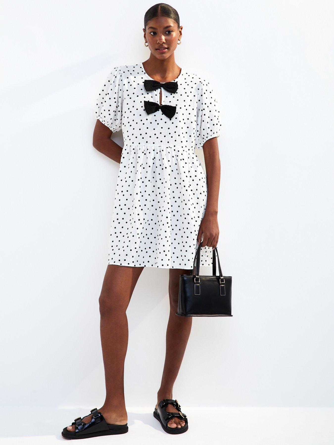 Image 1 of 4 of New Look White Bow Front Polka Dot Crinkle Texture Mini Dress