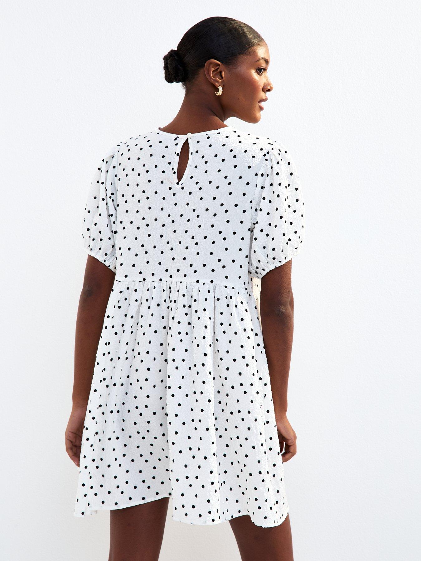 Image 2 of 4 of New Look White Bow Front Polka Dot Crinkle Texture Mini Dress