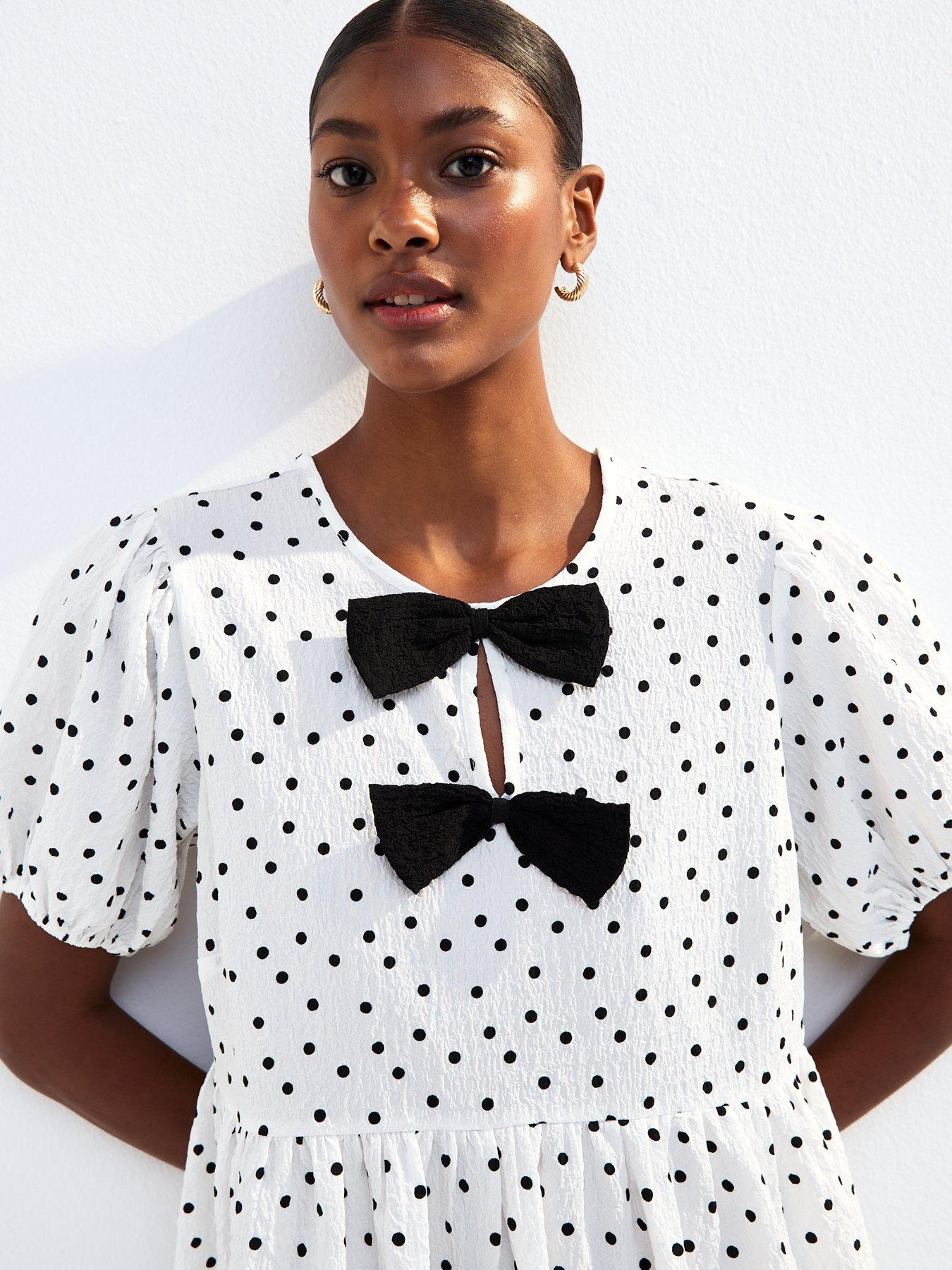 Image 4 of 4 of New Look White Bow Front Polka Dot Crinkle Texture Mini Dress