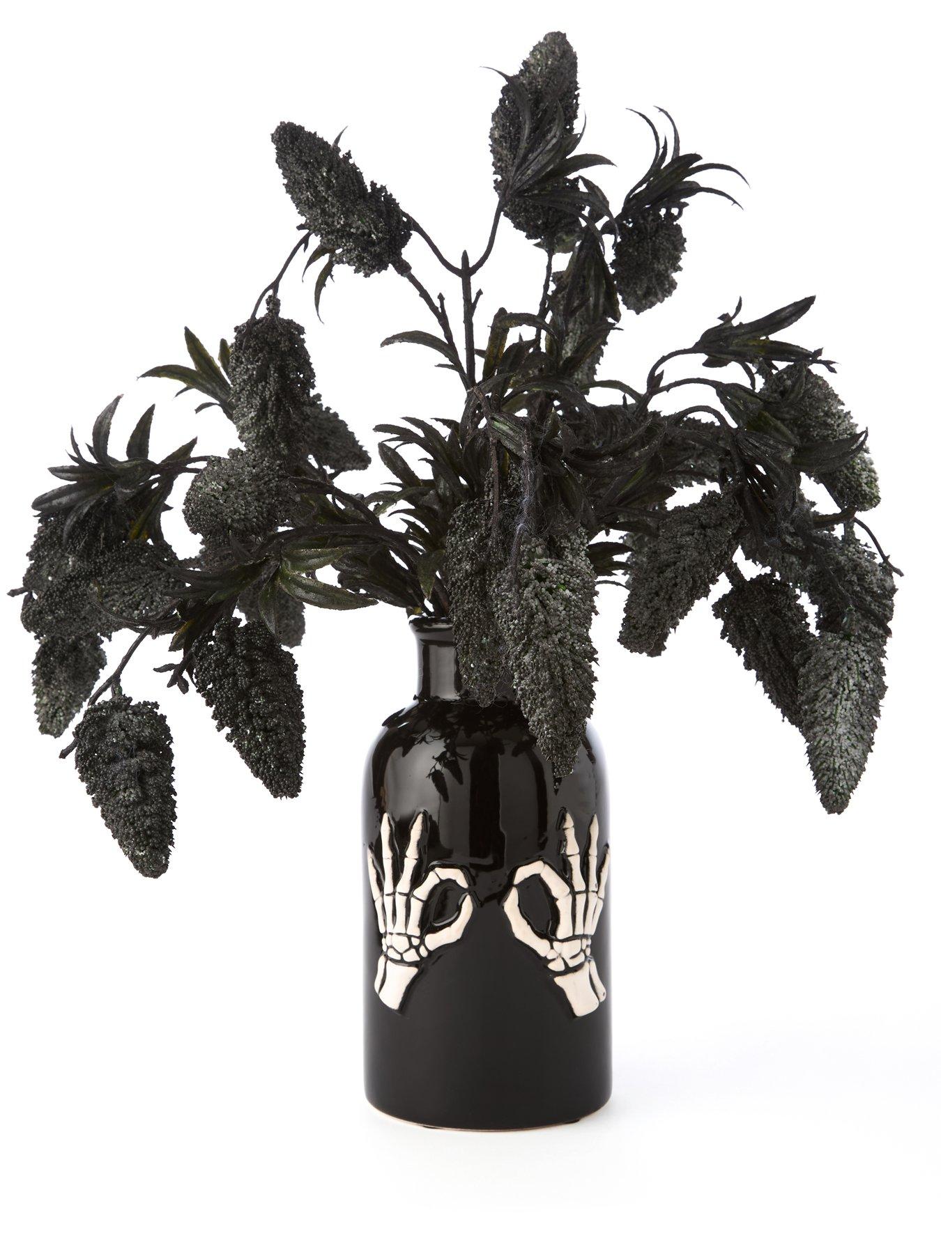 hocus-pocus-fruit-foliage-display-in-a-skeleton-hand-halloween-vasestillFront