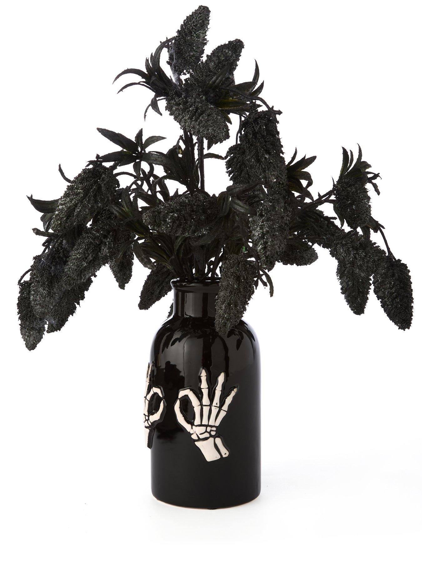 hocus-pocus-fruit-foliage-display-in-a-skeleton-hand-halloween-vaseback