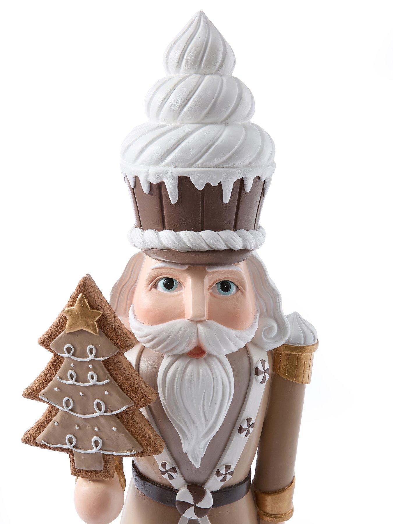 festive-93nbspcm-brownwhite-nutcracker-withnbspcake-hat-and-tree-christmas-decorationdetail