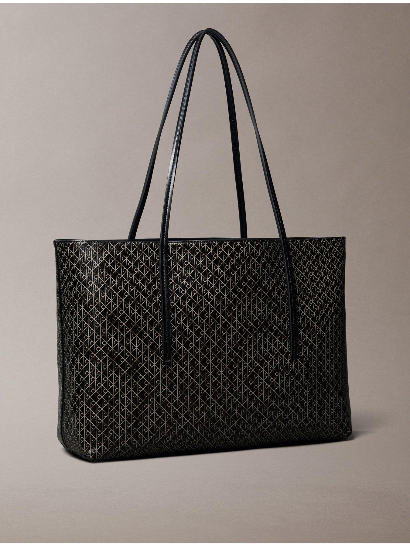 calvin-klein-large-pouch-monogram-tote-bag-brownstillFront