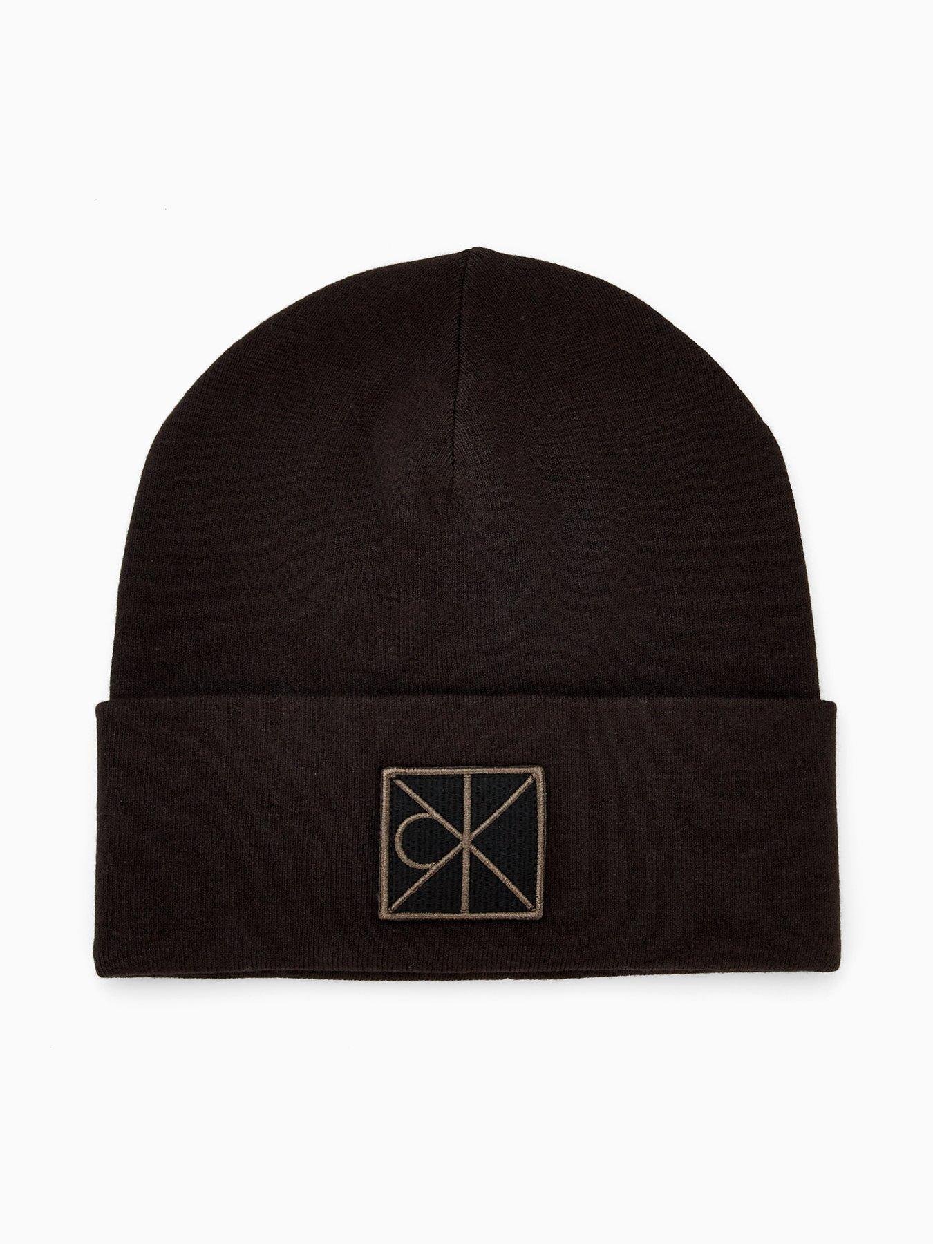 Image 1 of 4 of Calvin Klein Embellished Patch Ribbed Beanie - Black