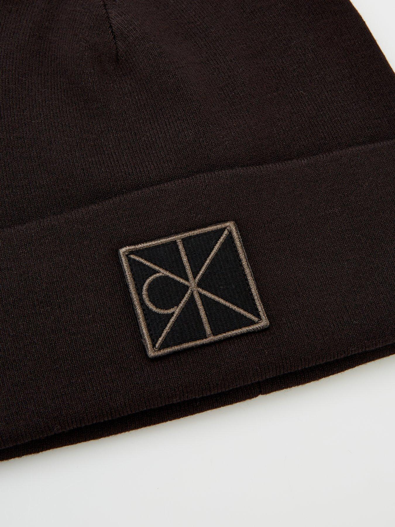 Image 3 of 4 of Calvin Klein Embellished Patch Ribbed Beanie - Black