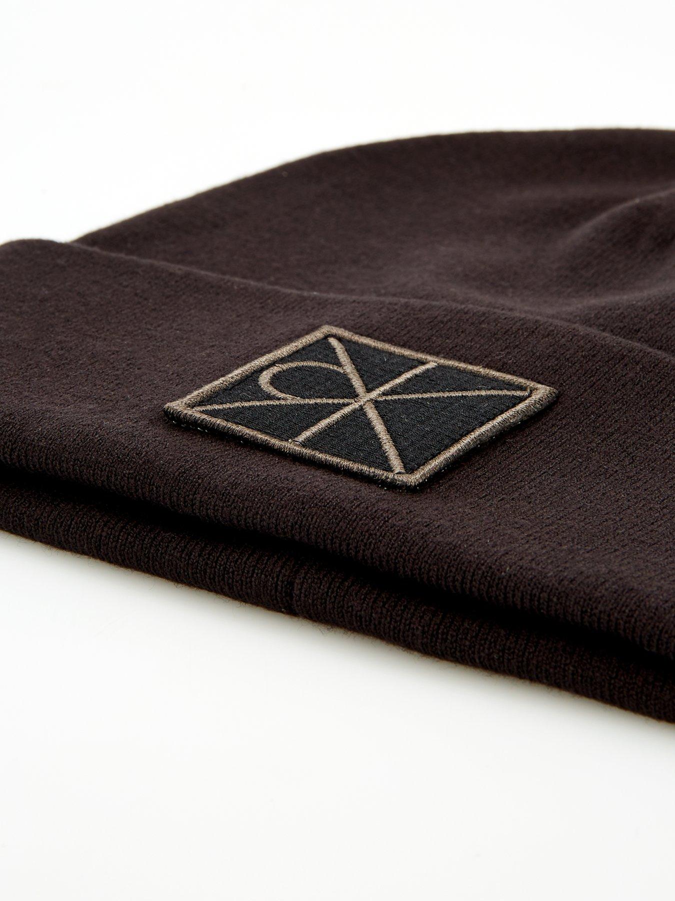 Image 4 of 4 of Calvin Klein Embellished Patch Ribbed Beanie - Black