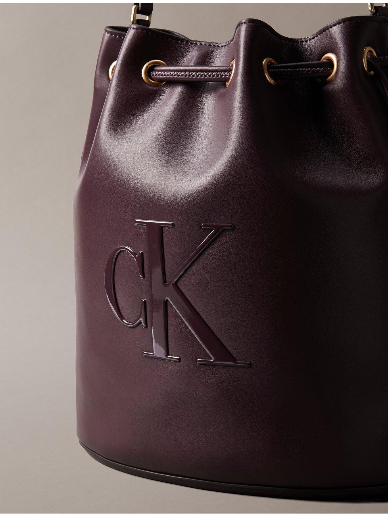 calvin-klein-raised-ck-logo-large-bucket-bag-brownoutfit