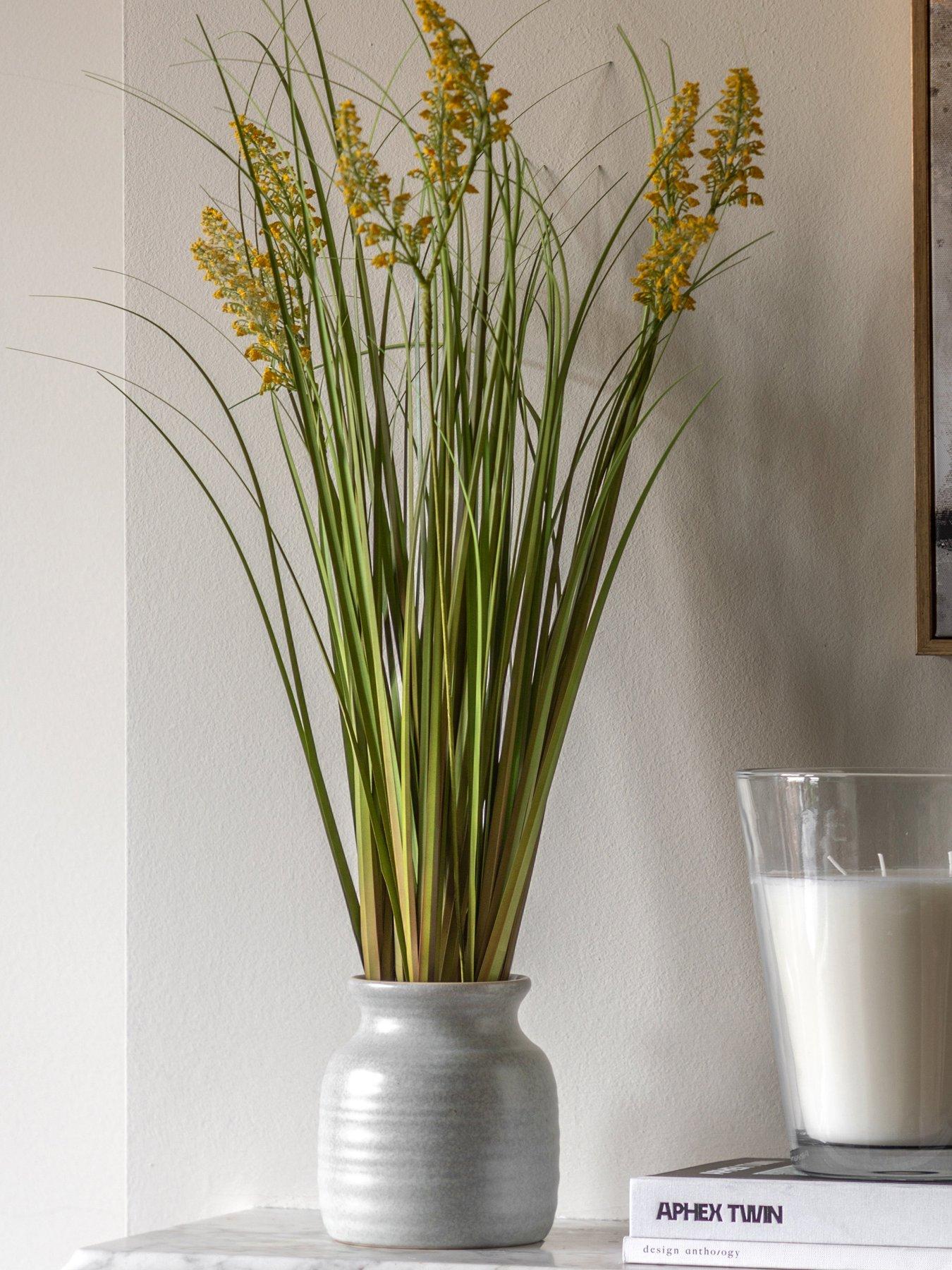 gallery-direct-potted-grass-with-yellow-wildflower