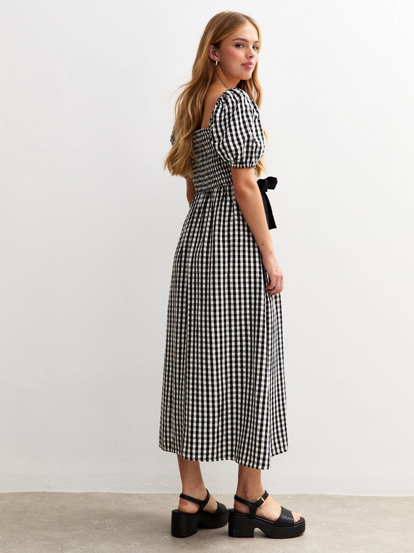 Image 2 of 4 of New Look Gingham Shirred Bow Front Midi Dress&nbsp;- Black