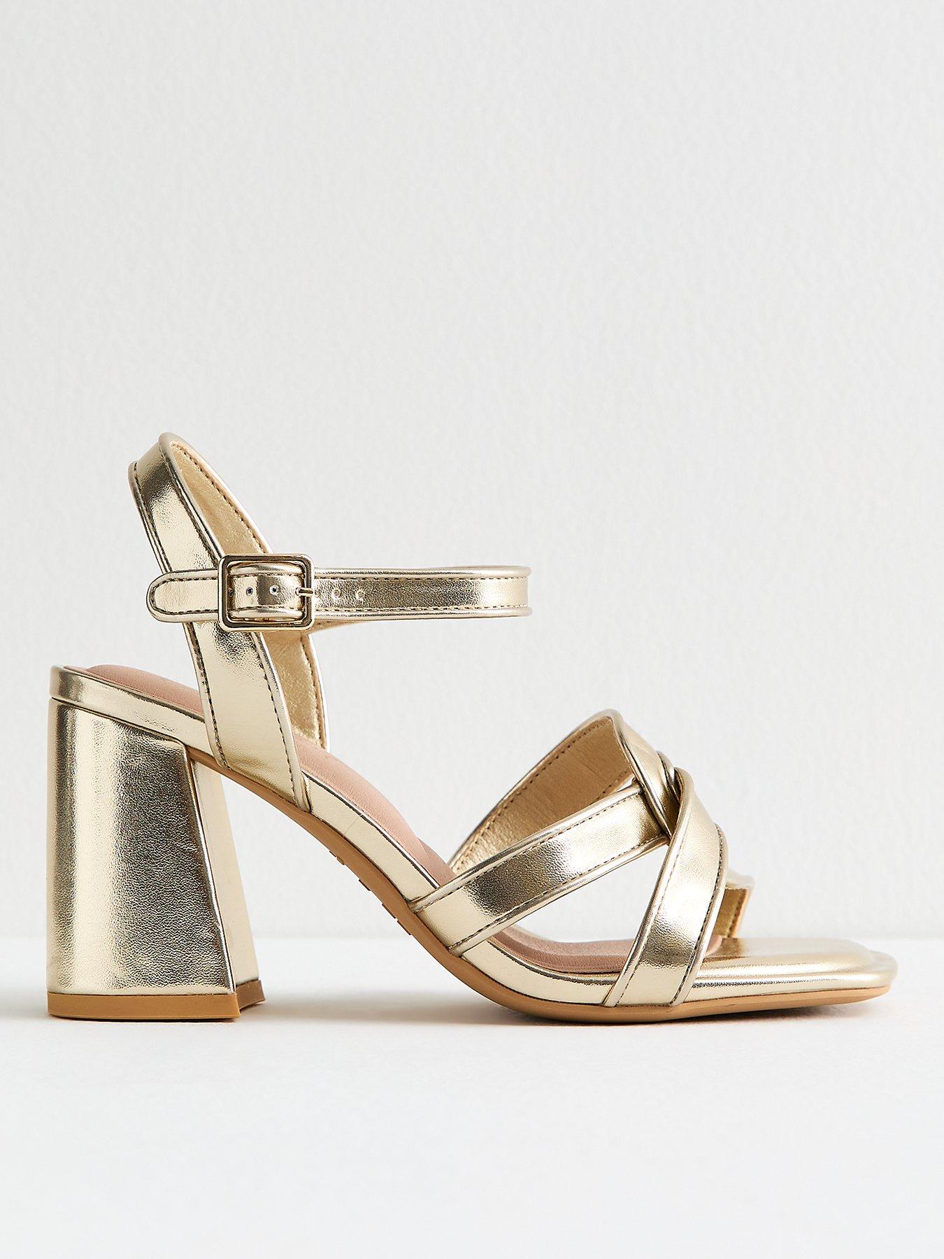 Image 1 of 6 of New Look Wide Fit Gold Metallic Twist Strap Block Heel Sandals
