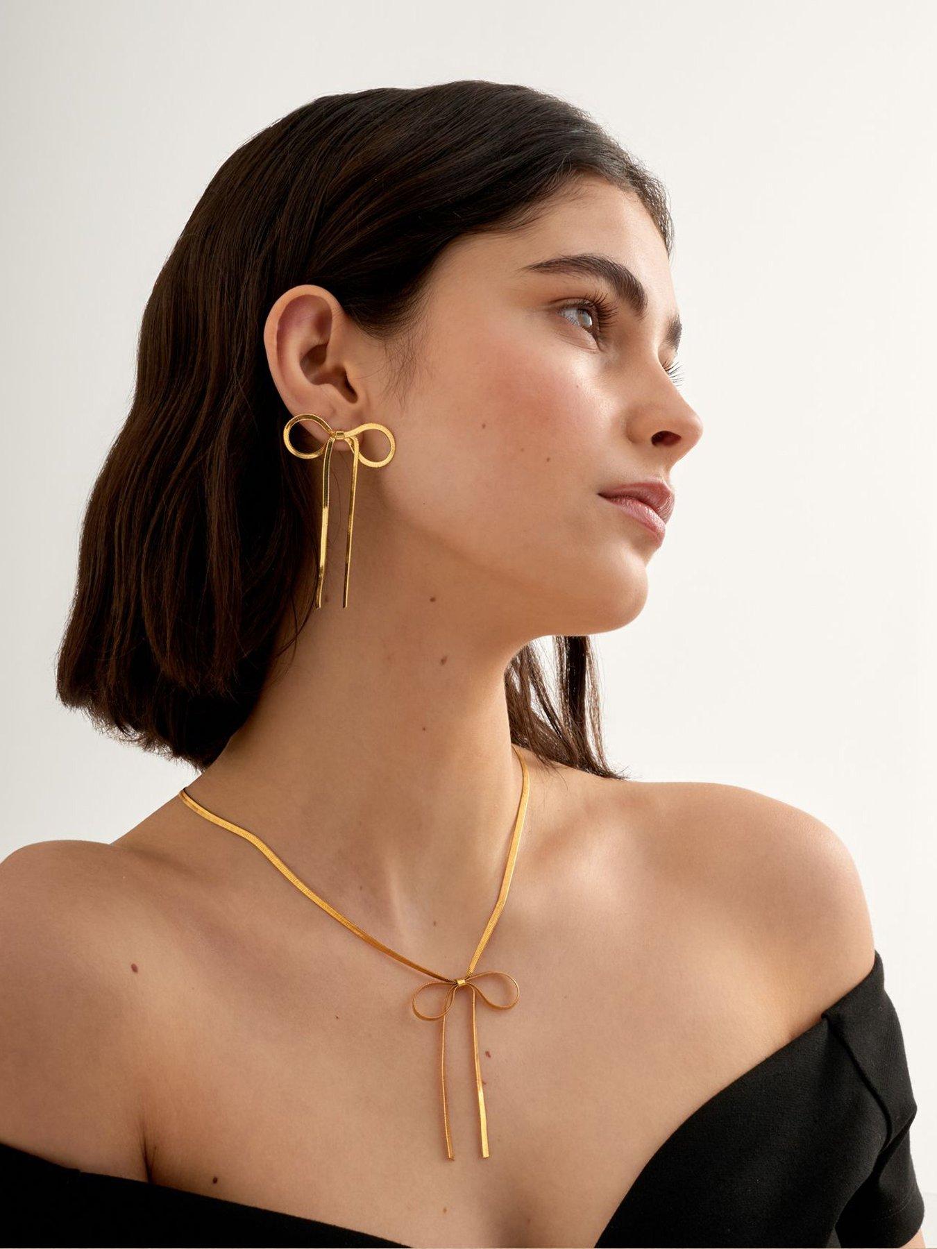 katie-loxton-amelie-bow-oversized-earrings-gold-coatedstillFront
