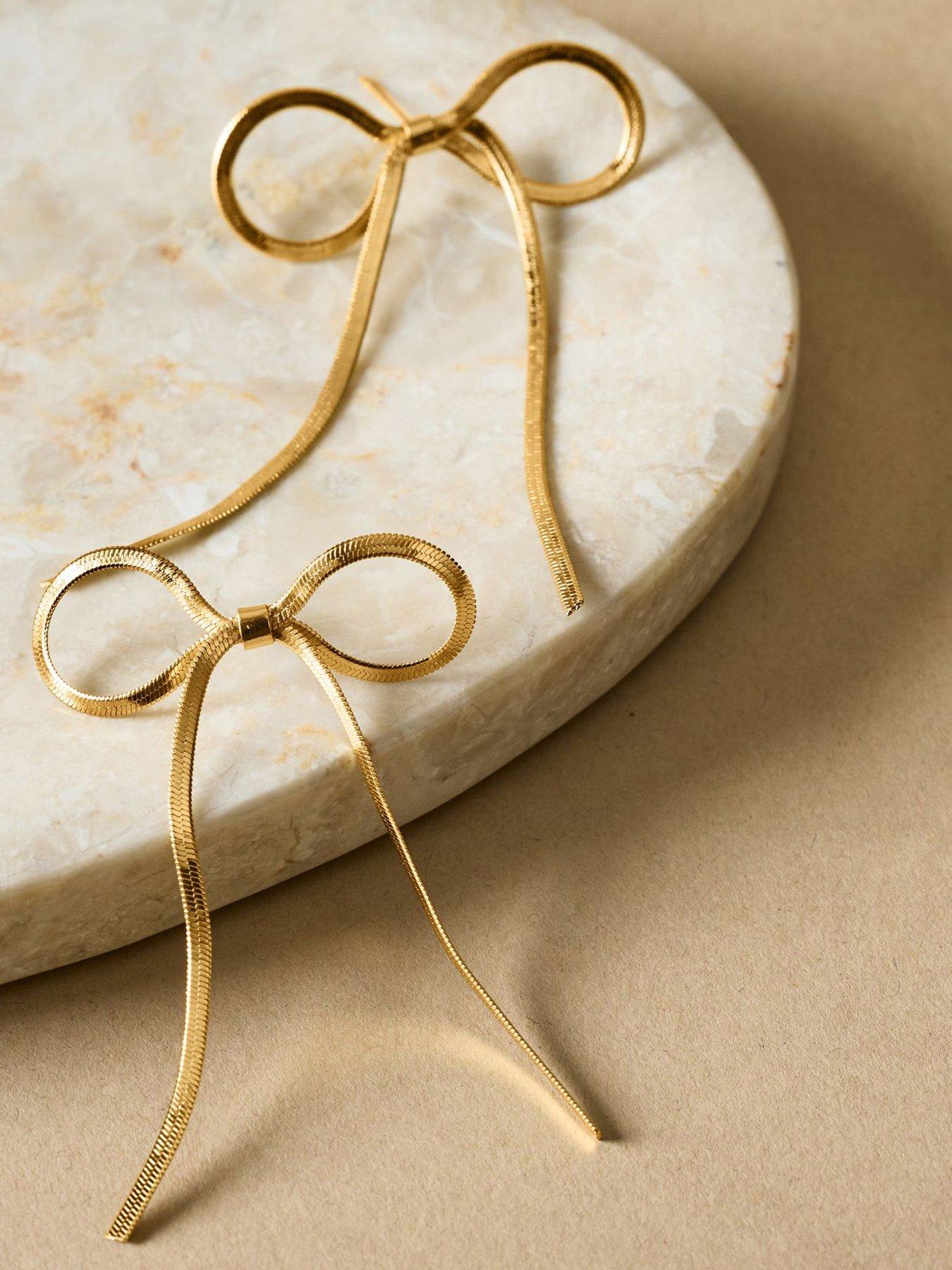 katie-loxton-amelie-bow-oversized-earrings-gold-coatedoutfit