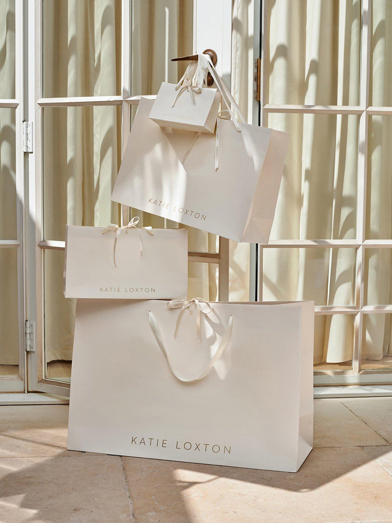 Image 4 of 4 of Katie Loxton Elsi Huggie Hoop Earrings , Gold Coated , 1.3cm x 0.3cm x 1.1cm - Waterproof