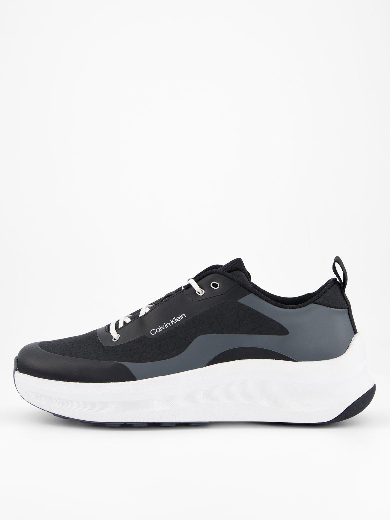 Image 1 of 7 of Calvin Klein Andrea All Over Emblem Trainers - Black