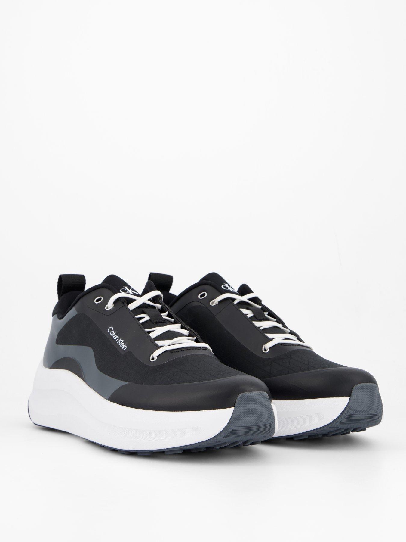 Image 6 of 7 of Calvin Klein Andrea All Over Emblem Trainers - Black