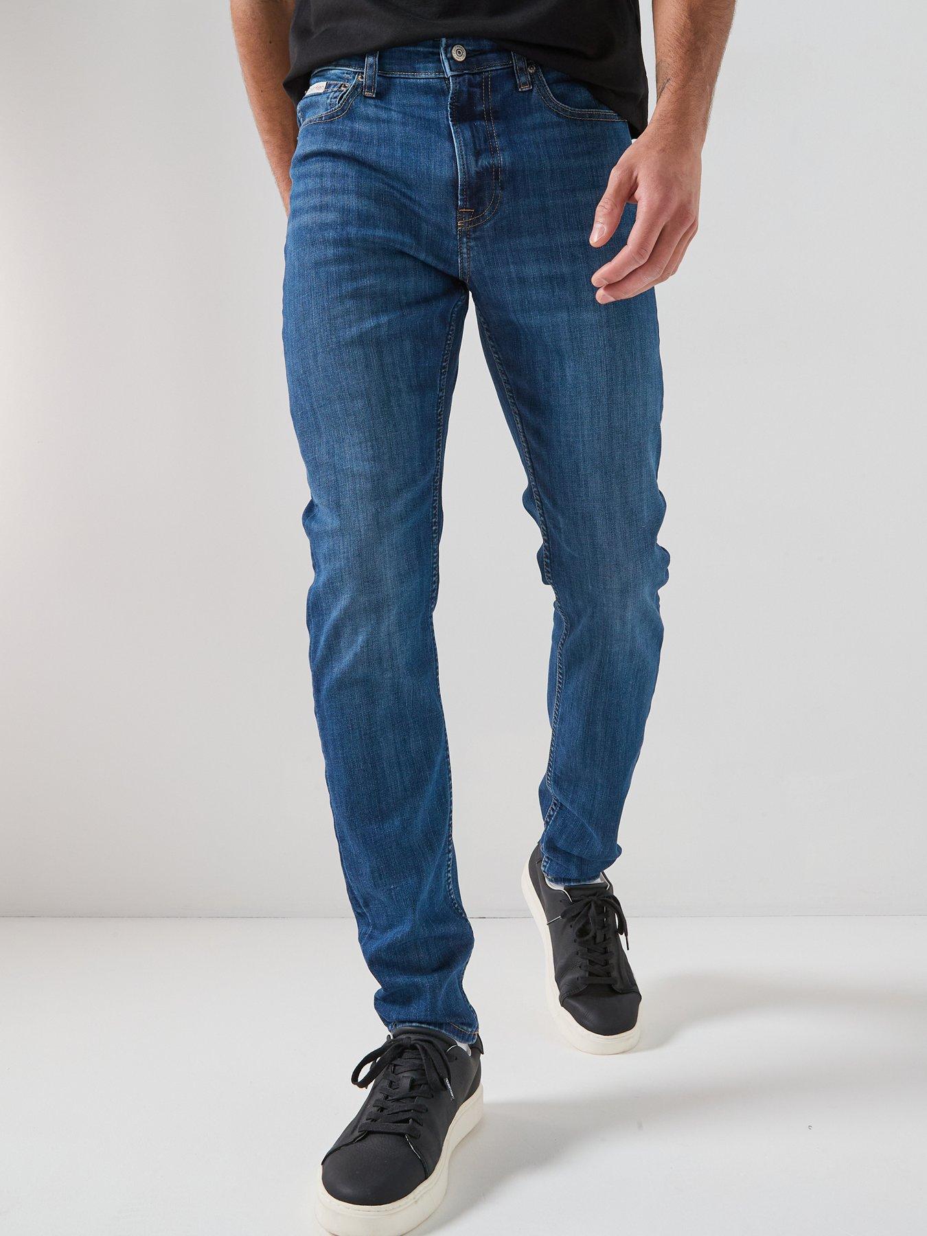 Image 1 of 6 of Calvin Klein Slim Fit Tapered Jean - Dark Blue