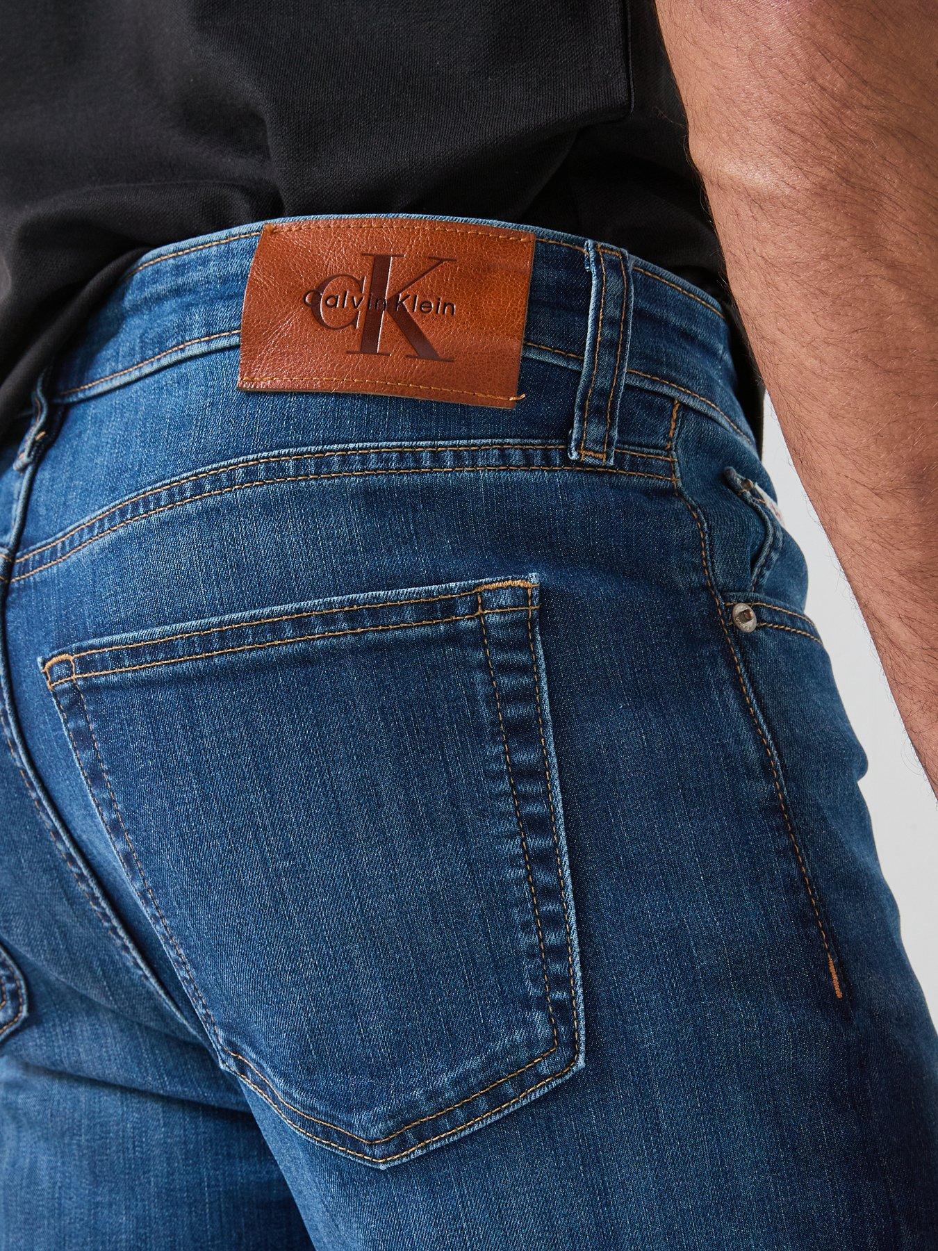 Image 4 of 6 of Calvin Klein Slim Fit Tapered Jean - Dark Blue