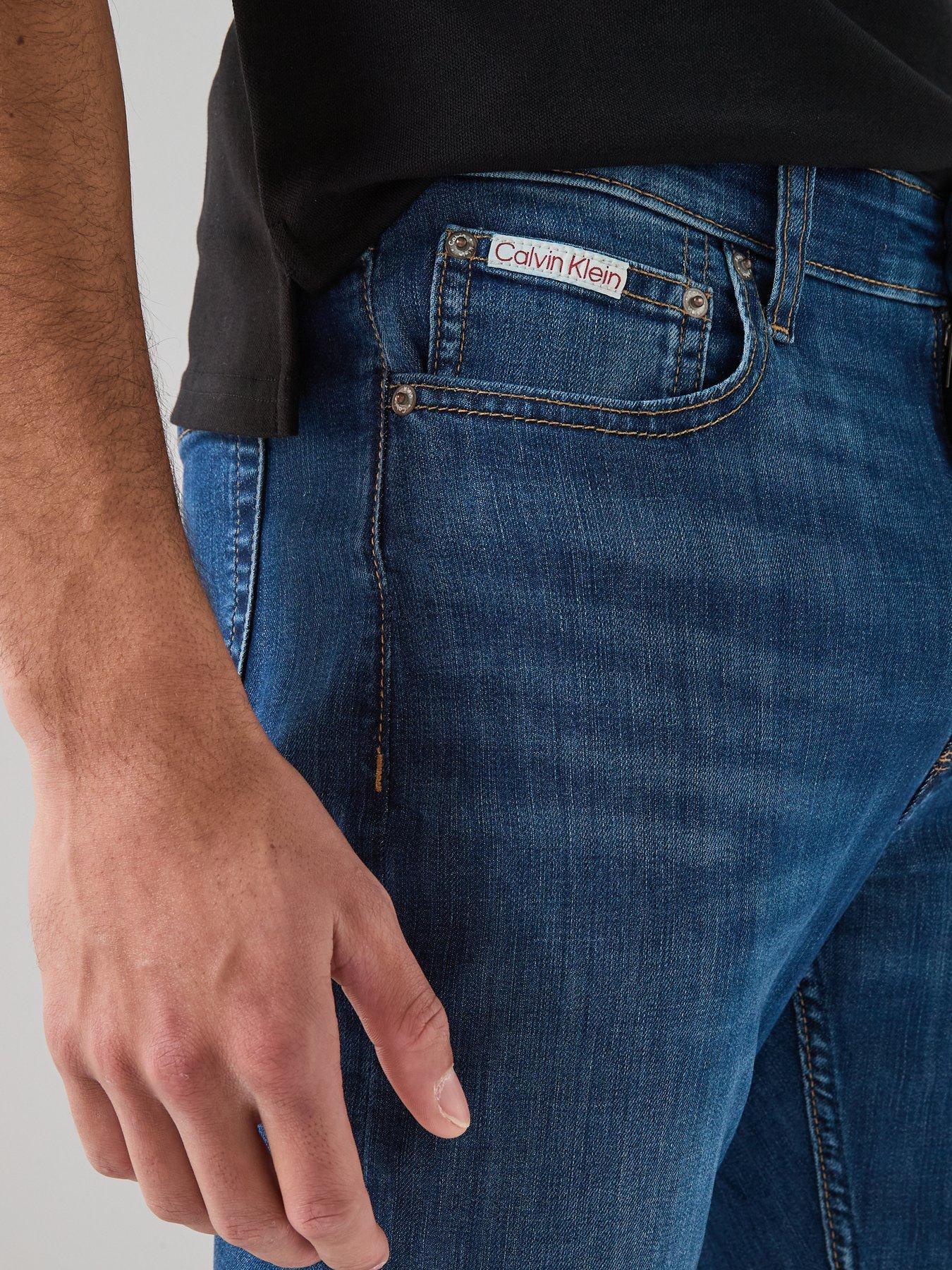 Image 5 of 6 of Calvin Klein Slim Fit Tapered Jean - Dark Blue