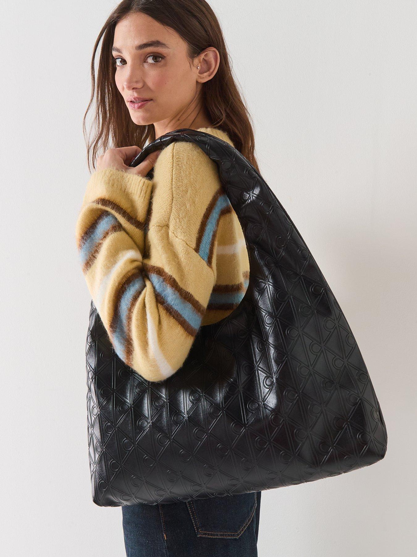 calvin-klein-large-puffer-shoulder-bag-blackstillFront