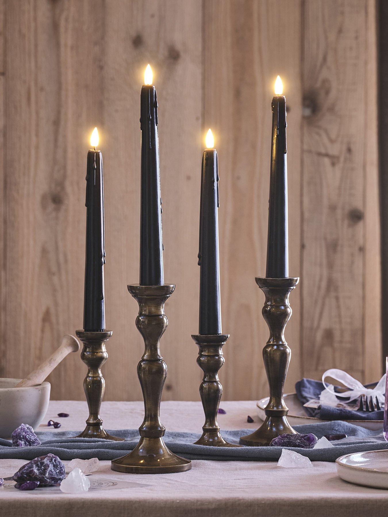 lights4fun-4-truglow-black-dripping-wax-led-taper-candles-with-remote-controlfront