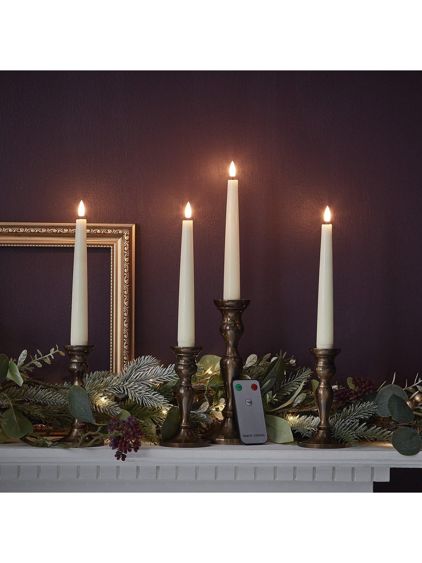 lights4fun-4-ivory-truglow-remote-control-short-led-taper-candlesback