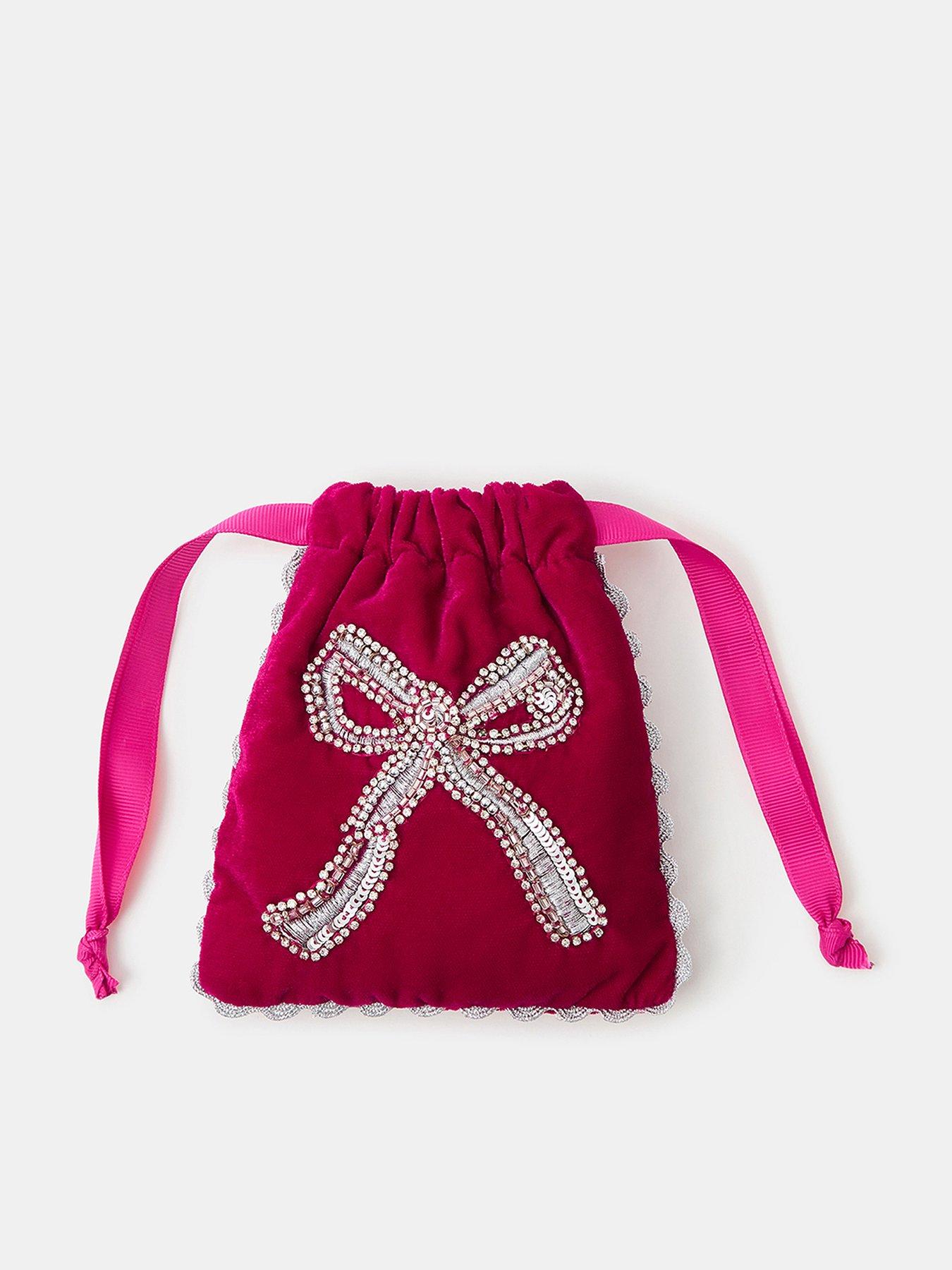 Image 1 of 3 of Accessorize Sequin Bow Drawstring Bag - Pink