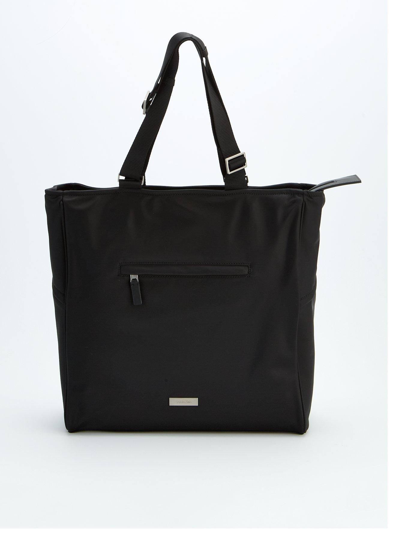 Image 1 of 6 of Calvin Klein Sleek Pocket Tote Bag - Black