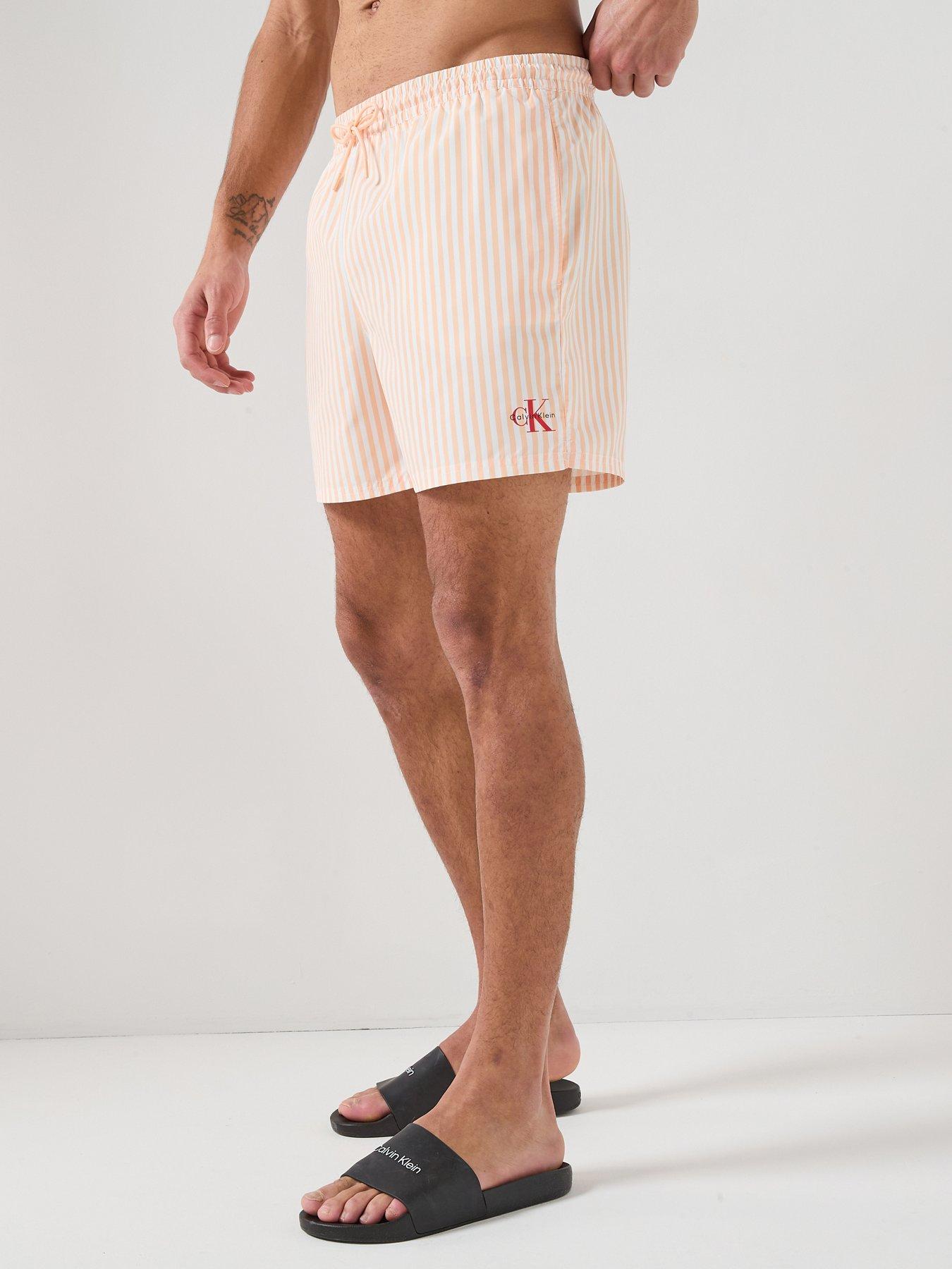 calvin-klein-graphic-mono-logo-striped-medium-swim-shorts-orange