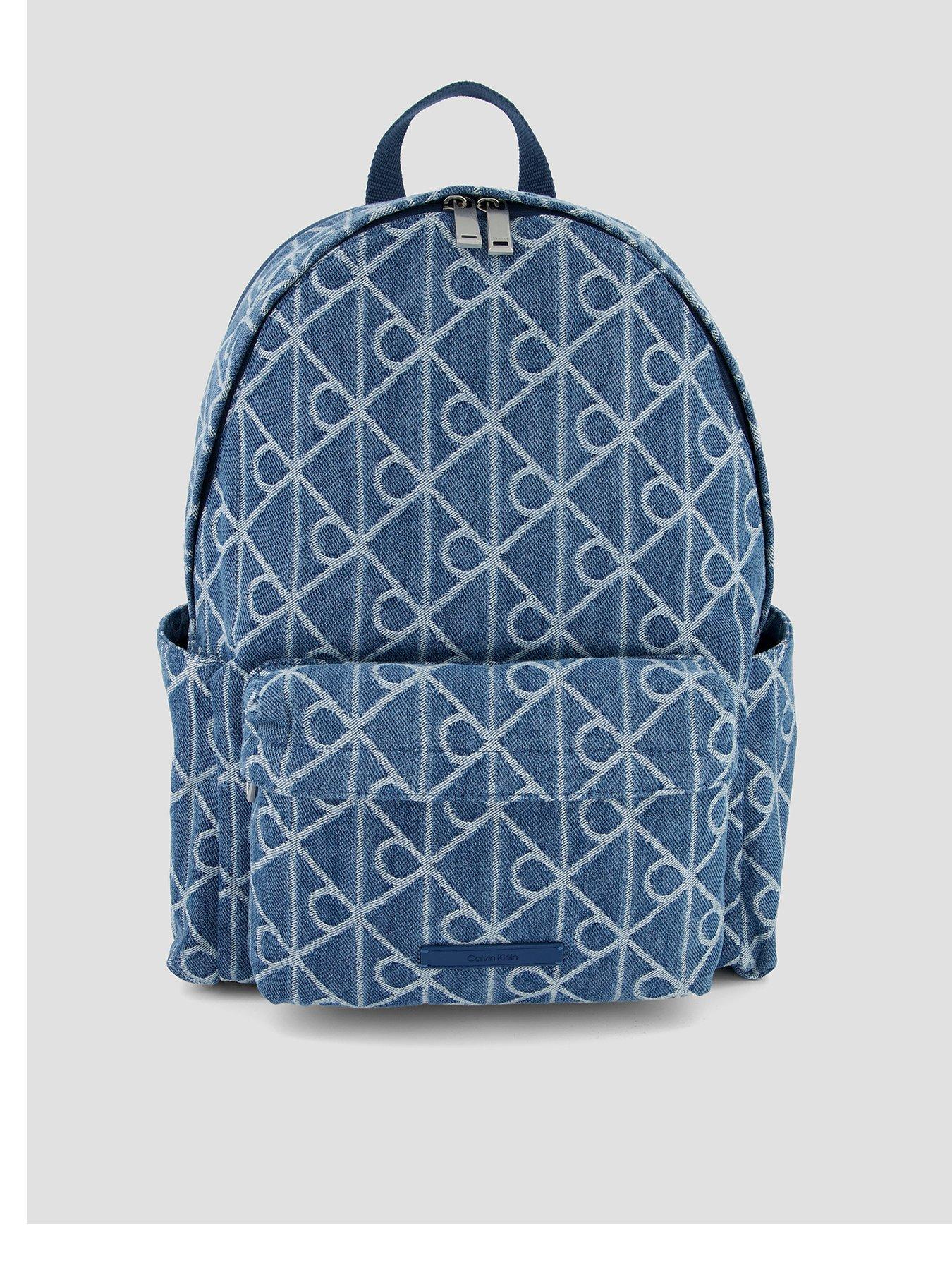 Image 1 of 4 of Calvin Klein Emblem Allover Print Denim Round Backpack - Blue