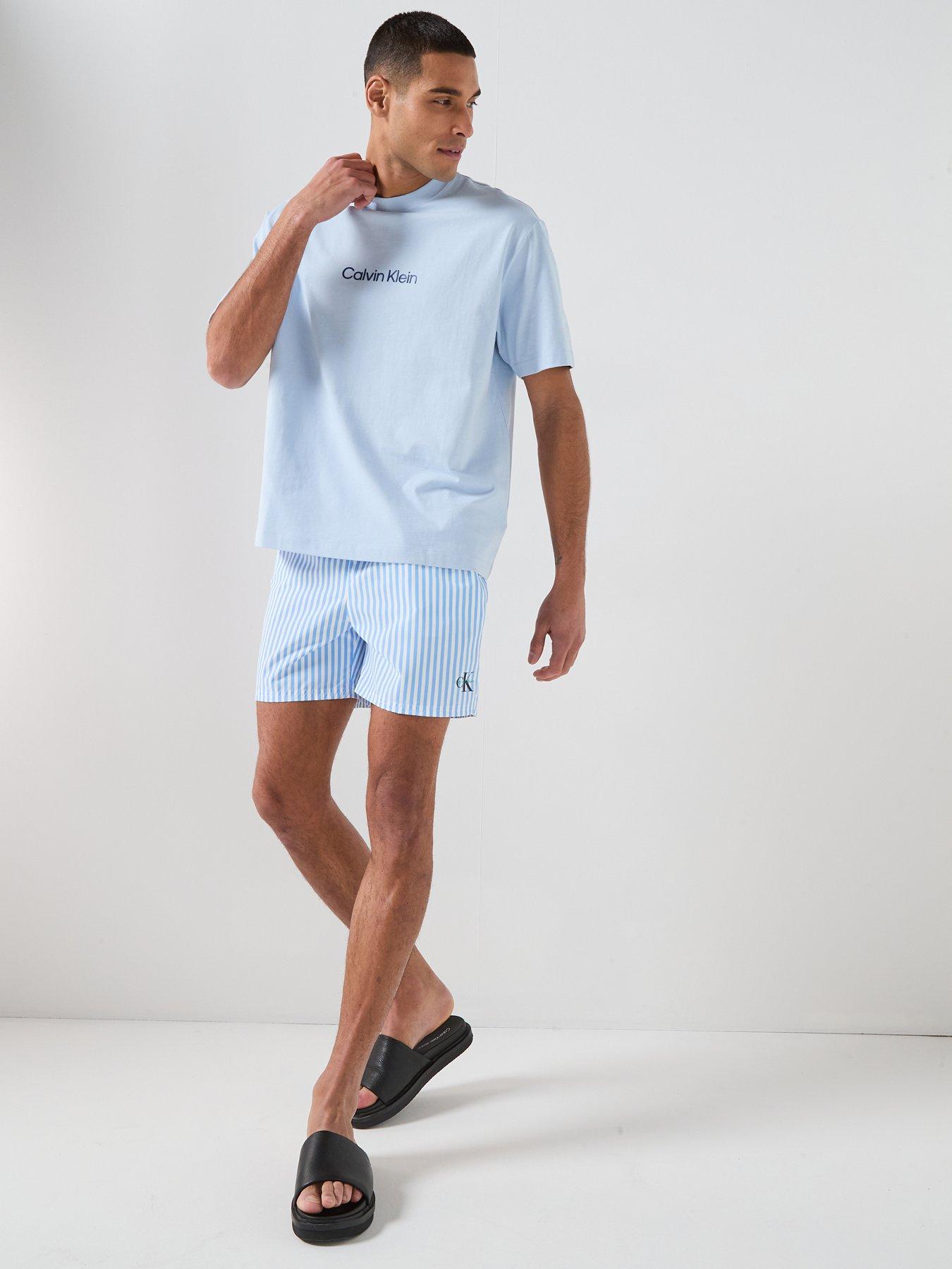 calvin-klein-graphic-mono-logo-striped-medium-swim-shorts-light-blueback
