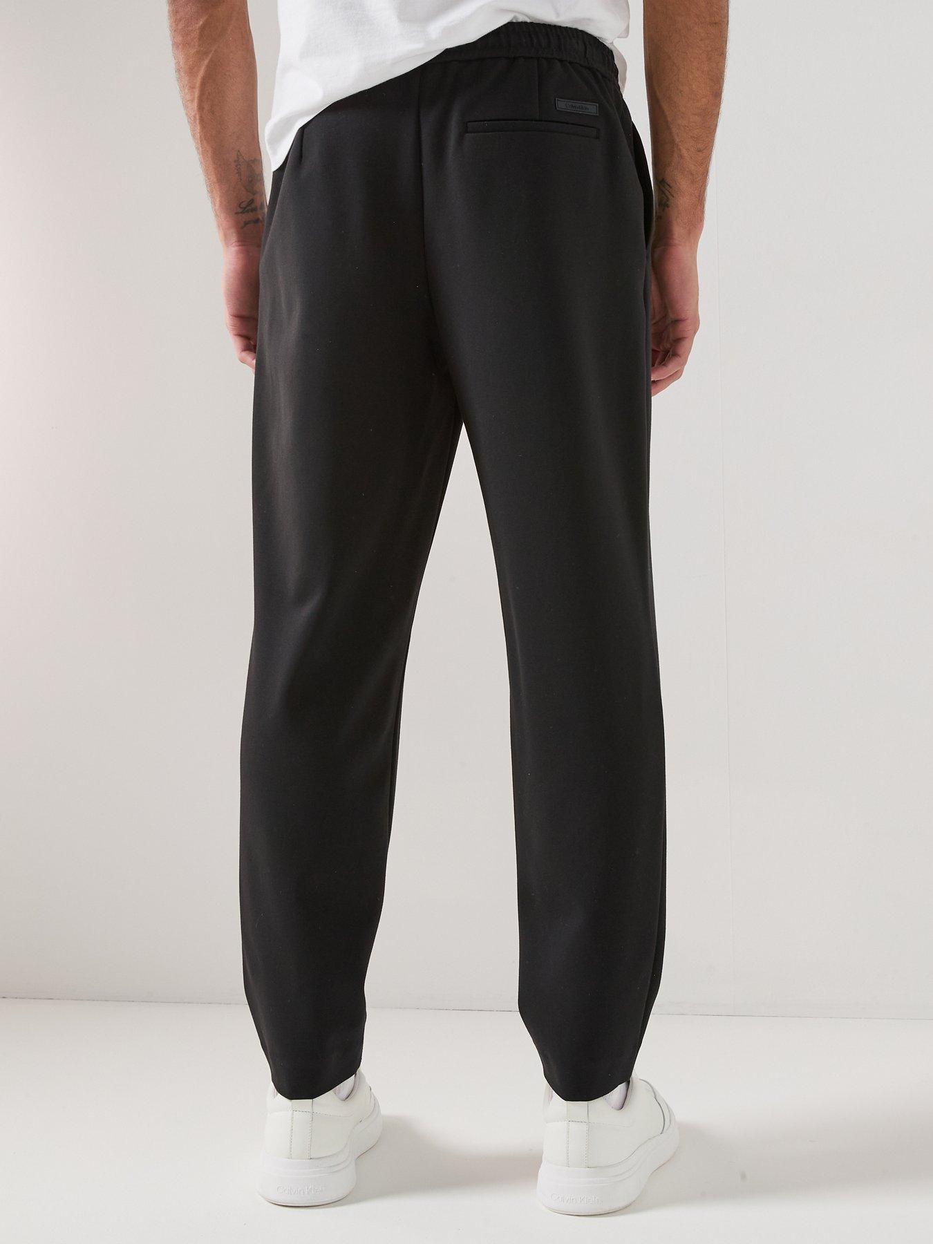 calvin-klein-tapered-tech-knit-pleated-joggers-blackstillFront