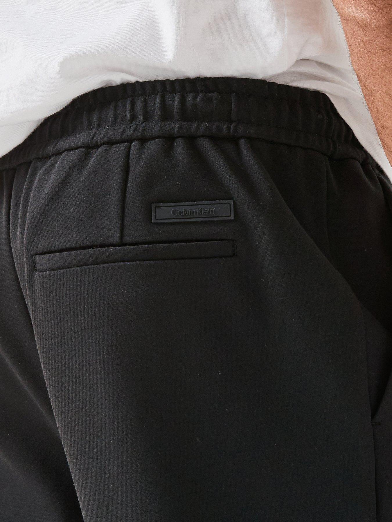 calvin-klein-tapered-tech-knit-pleated-joggers-blackoutfit