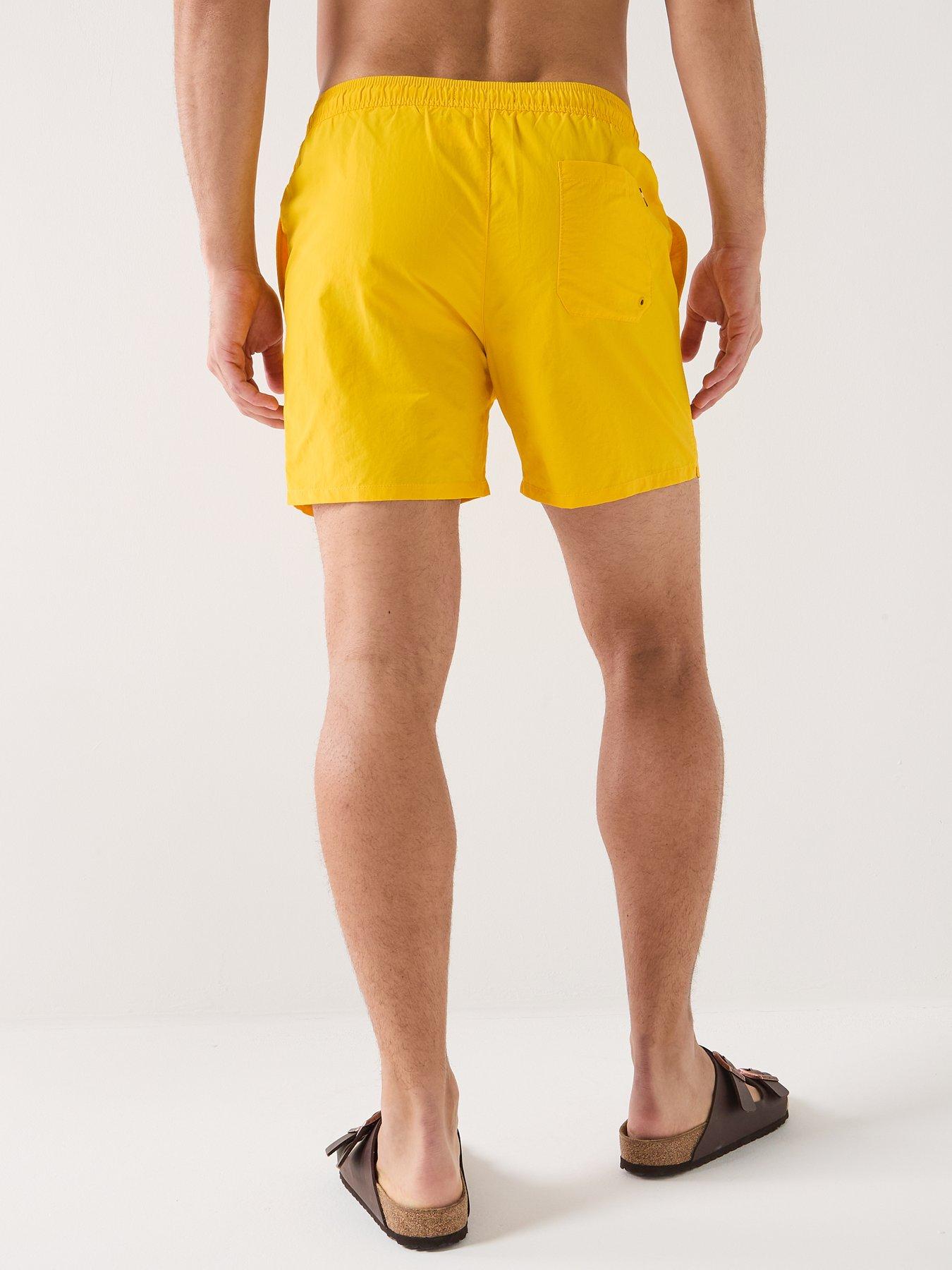 tommy-hilfiger-essential-small-flag-medium-swim-shorts-yellowstillFront
