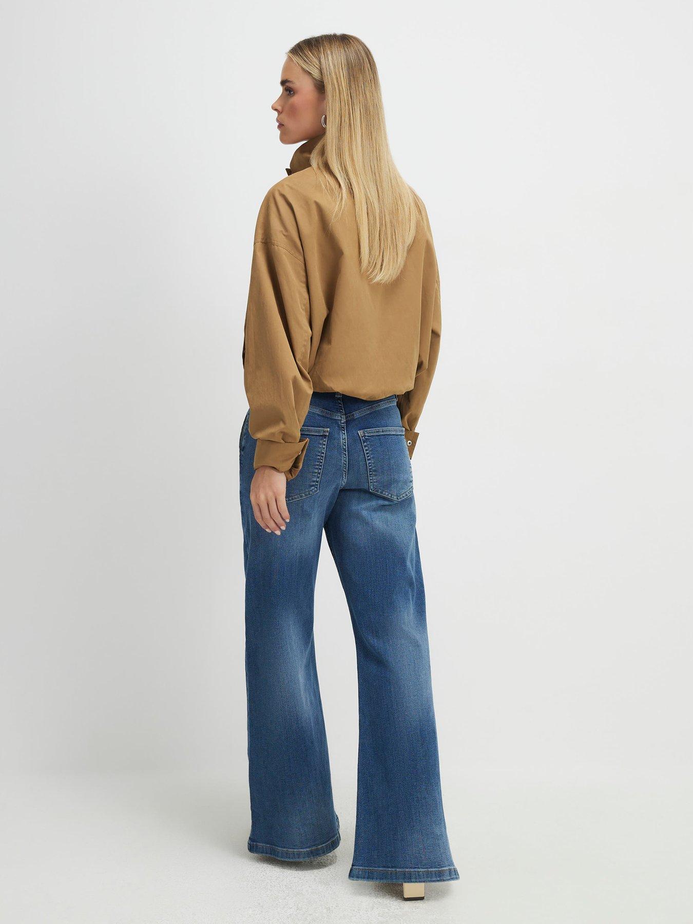 Image 2 of 2 of River Island Petite High Rise Wide Snaffle Flare Jeans - Blue