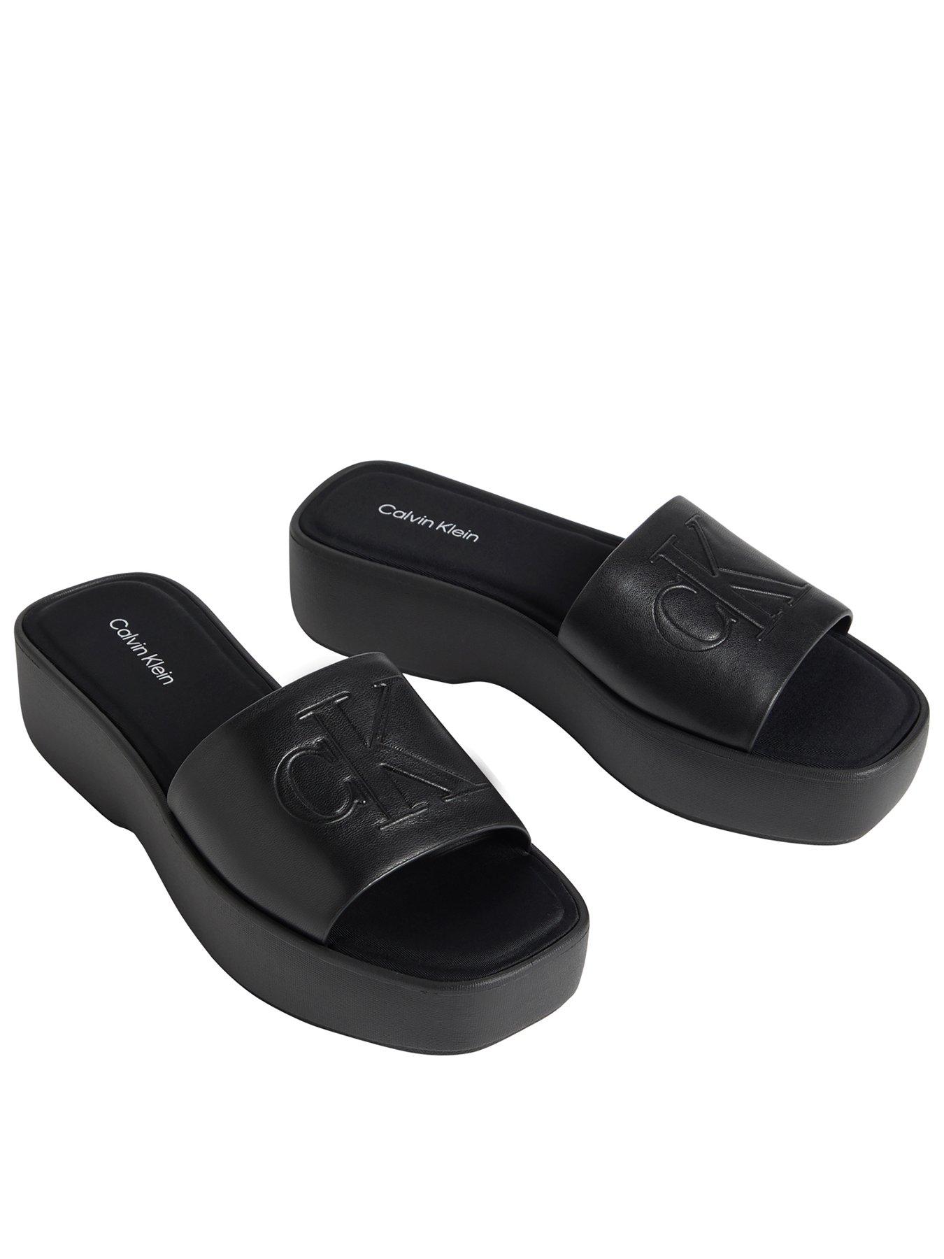 Image 1 of 2 of Calvin Klein Flat Sandals with Monogram - Black
