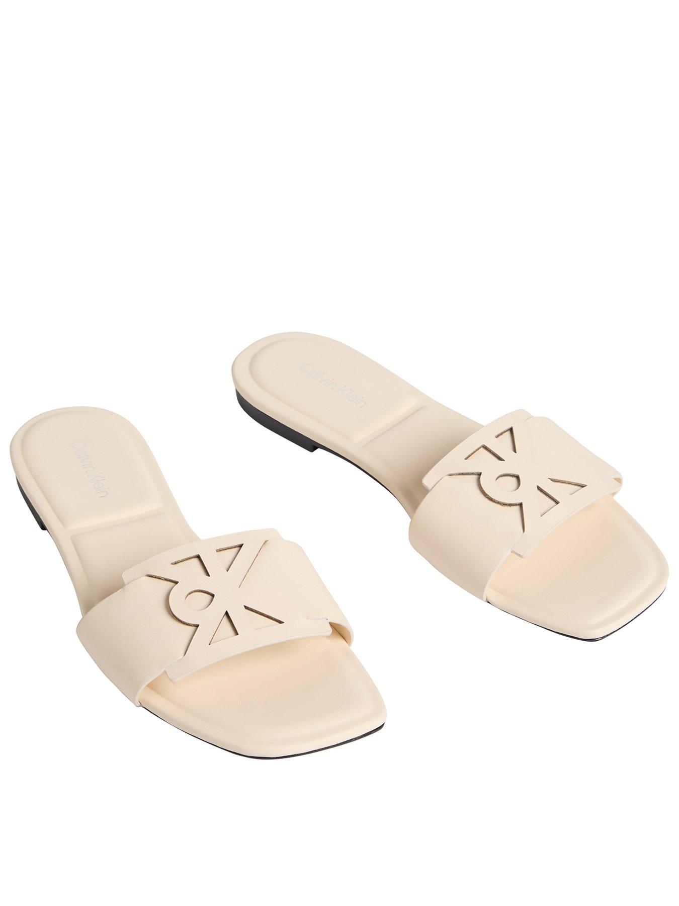 calvin-klein-square-flat-sandal-emblem-beigefront