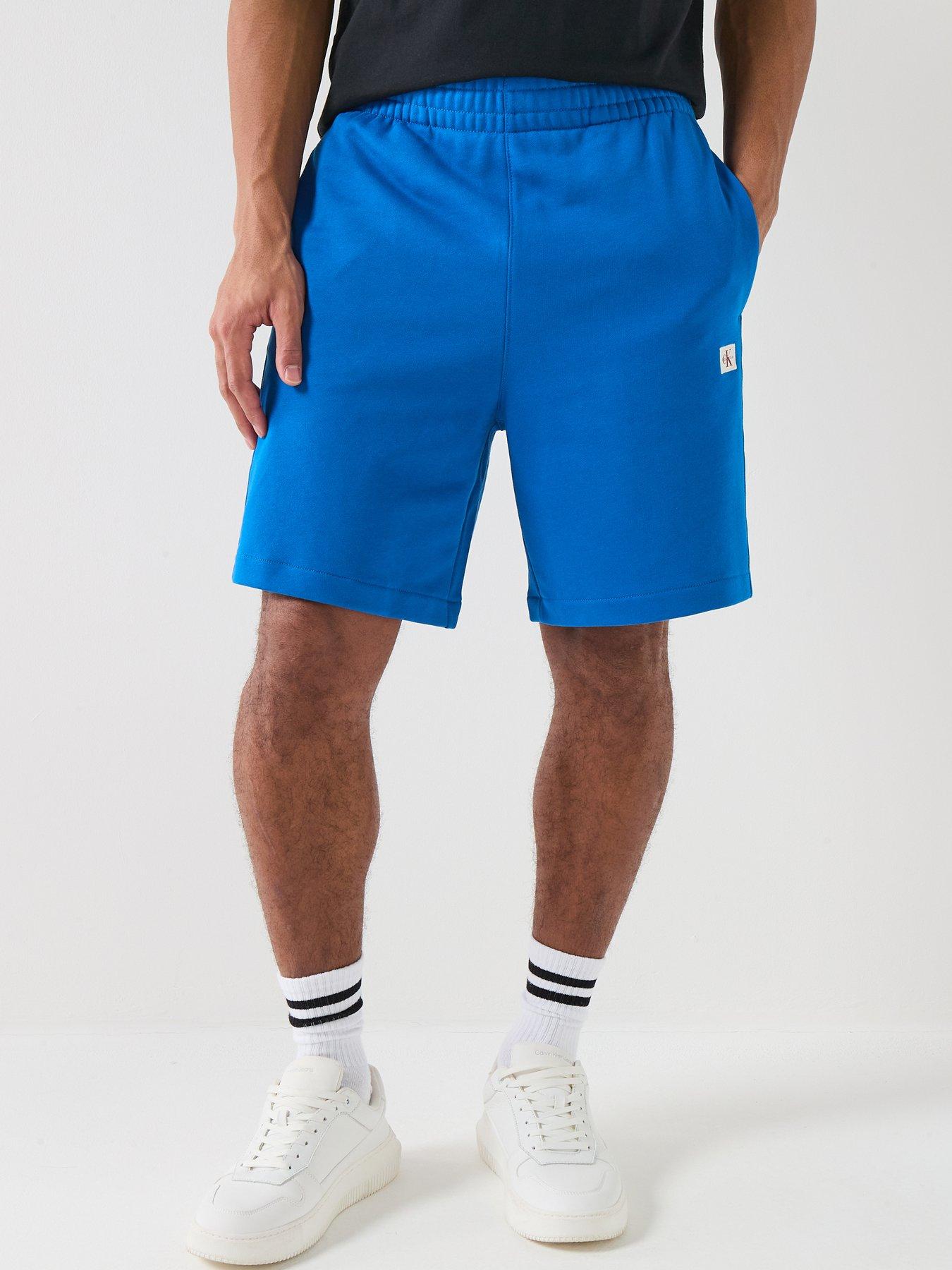 Image 1 of 6 of Calvin Klein Jeans Sweat Badge Short Shorts - Classic Blue