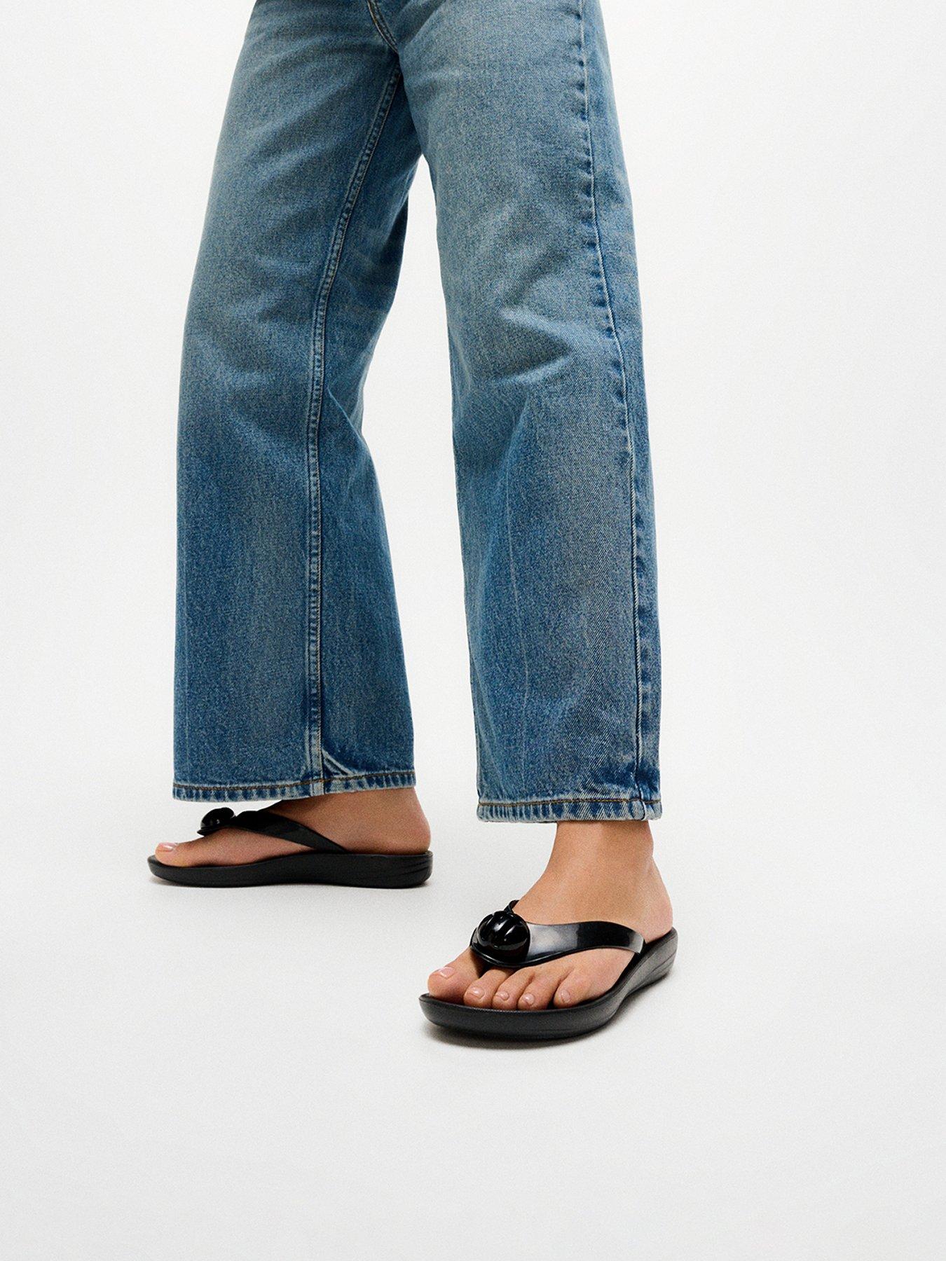 Image 1 of 6 of FitFlop Iqushion Glossy Button Flip-flops - Black