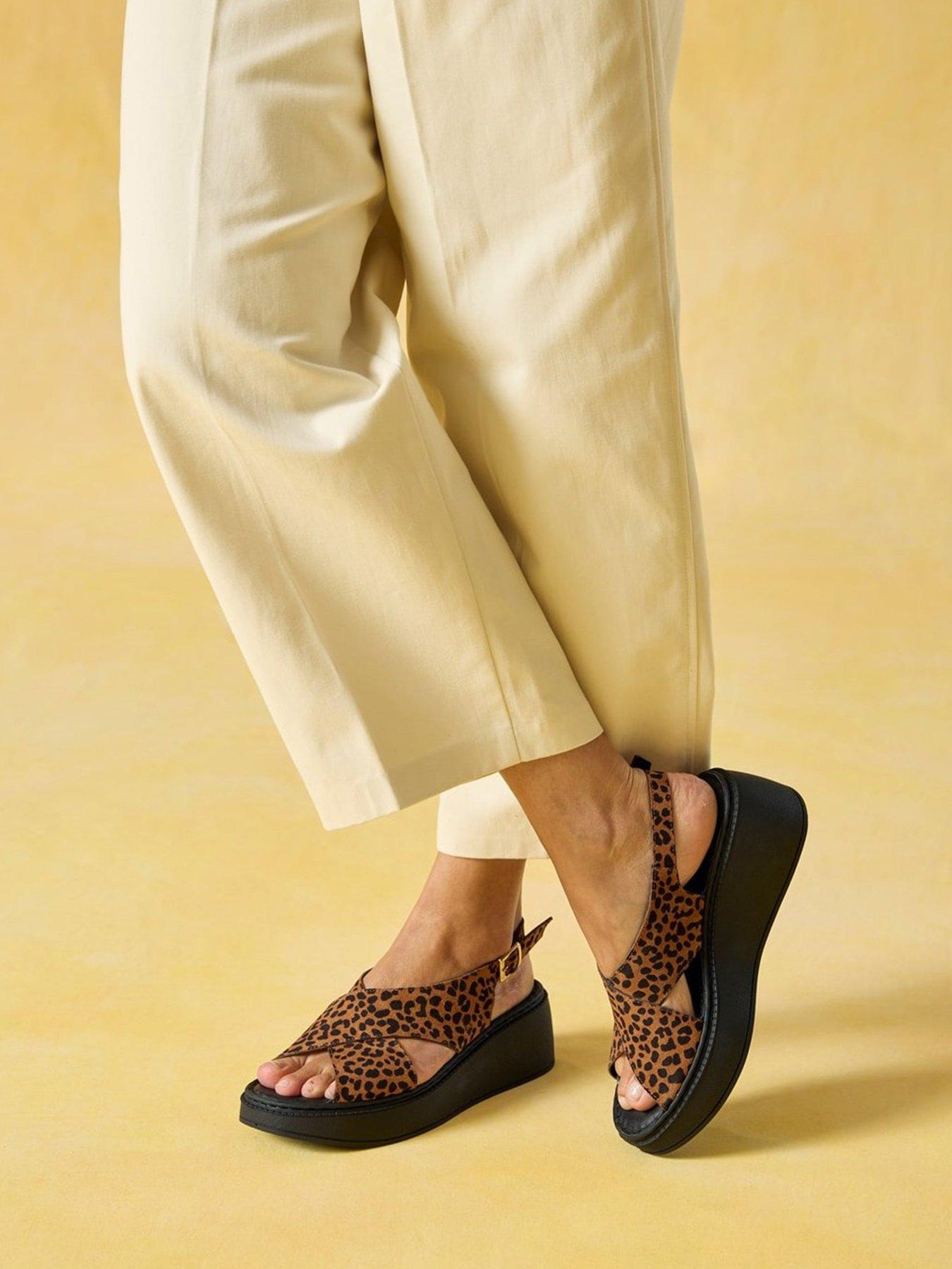 Image 1 of 7 of Hush Puppies Bex Leopard Wedge Sandals - Black