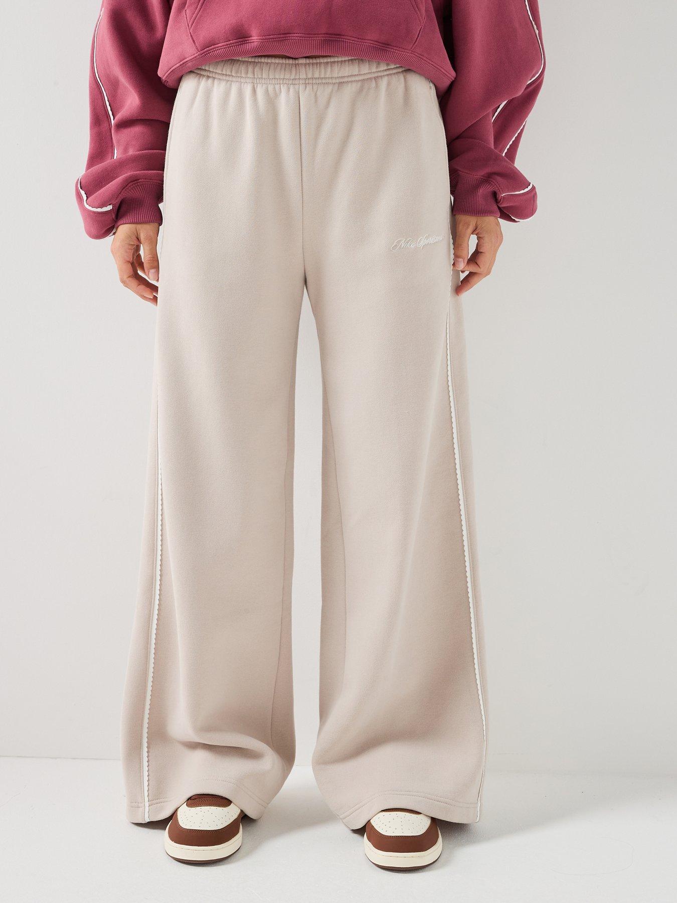Image 1 of 7 of Nike Womens Studio Fleece Scallop Tape Logo Open Hem Joggers - Cream