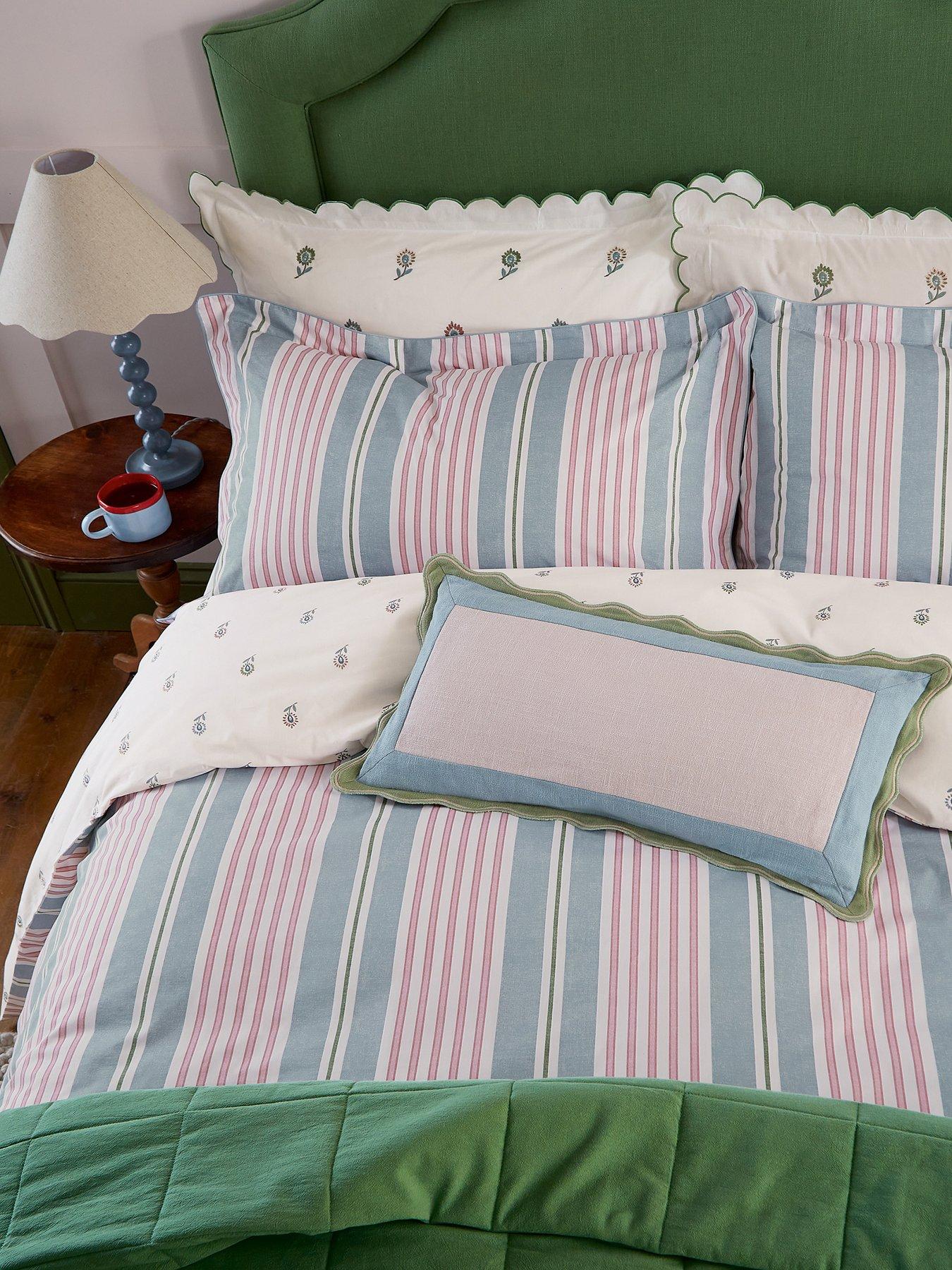 joules-come-rain-or-shine-cushion-60x30cm-greenback