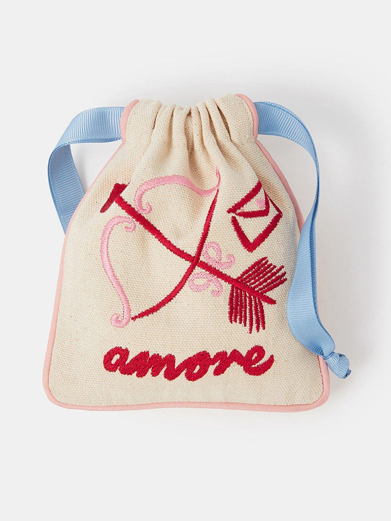 Image 1 of 3 of Accessorize Cupid Embroidered Drawstring Pouch - Cream