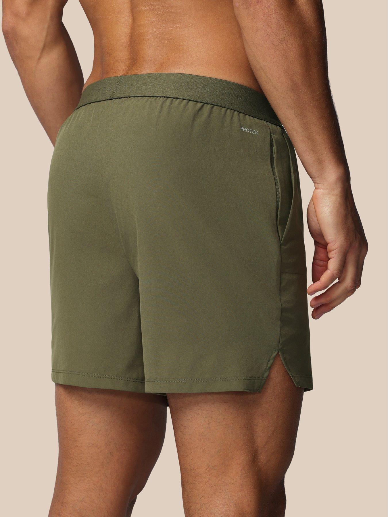 castore-mens-training-7-inch-branded-elastic-shorts-greenstillFront