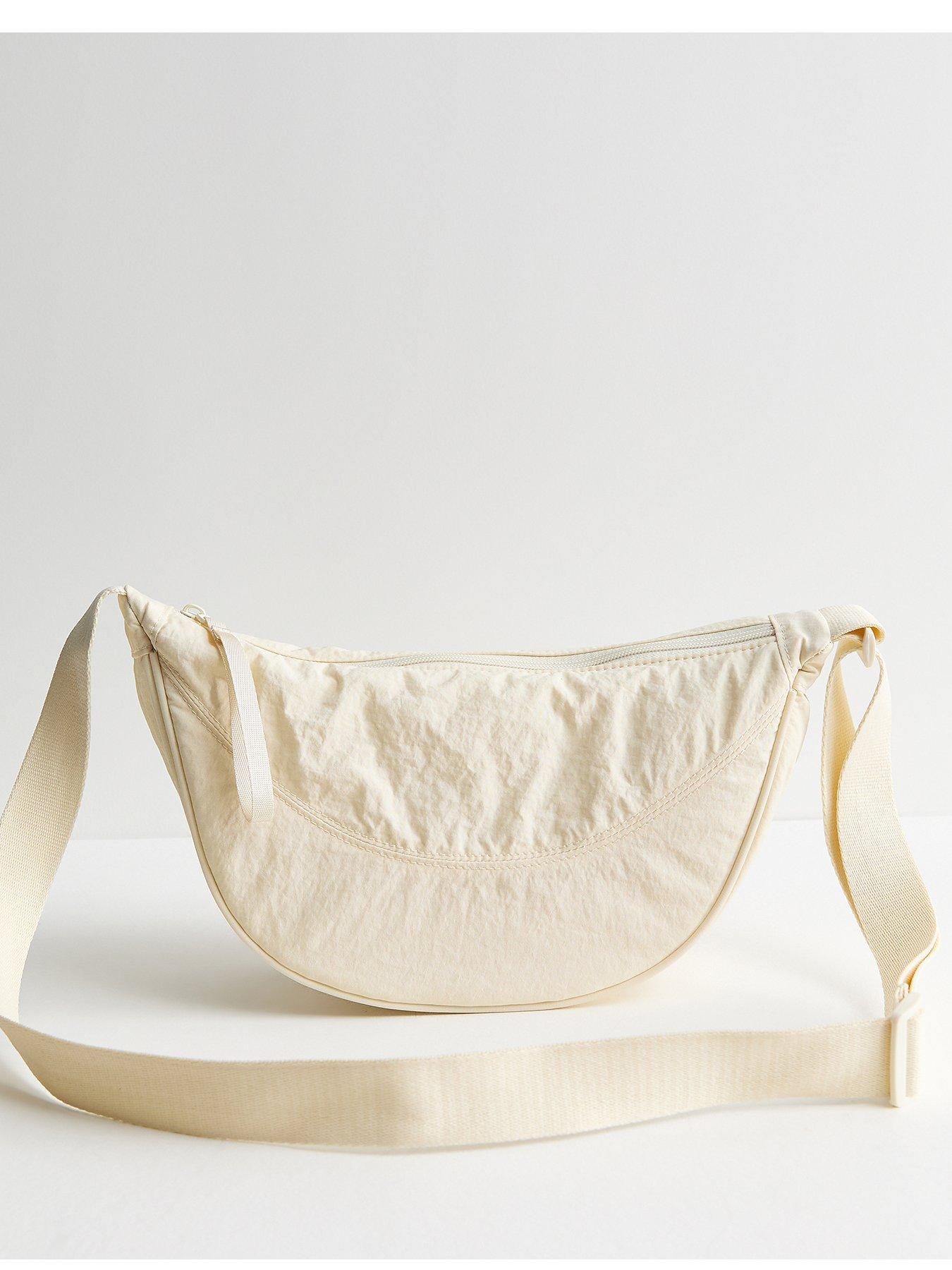 Image 2 of 5 of New Look Plain Curved Crossbody Bag - Cream