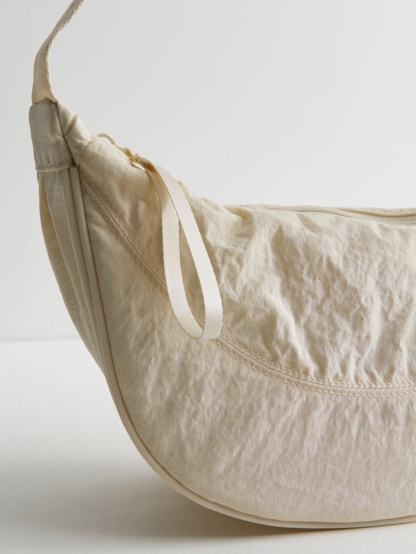 Image 4 of 5 of New Look Plain Curved Crossbody Bag - Cream