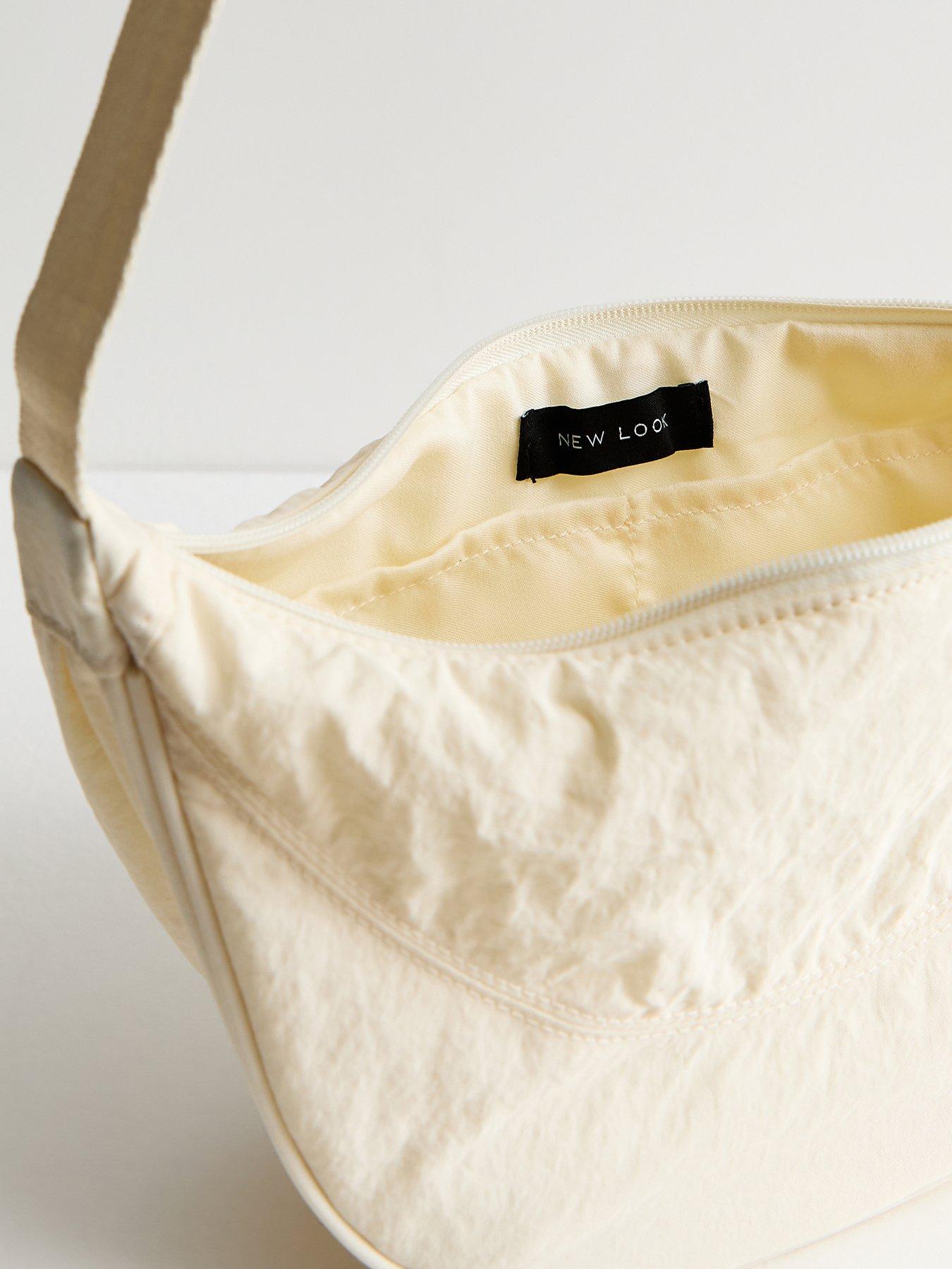 Image 5 of 5 of New Look Plain Curved Crossbody Bag - Cream