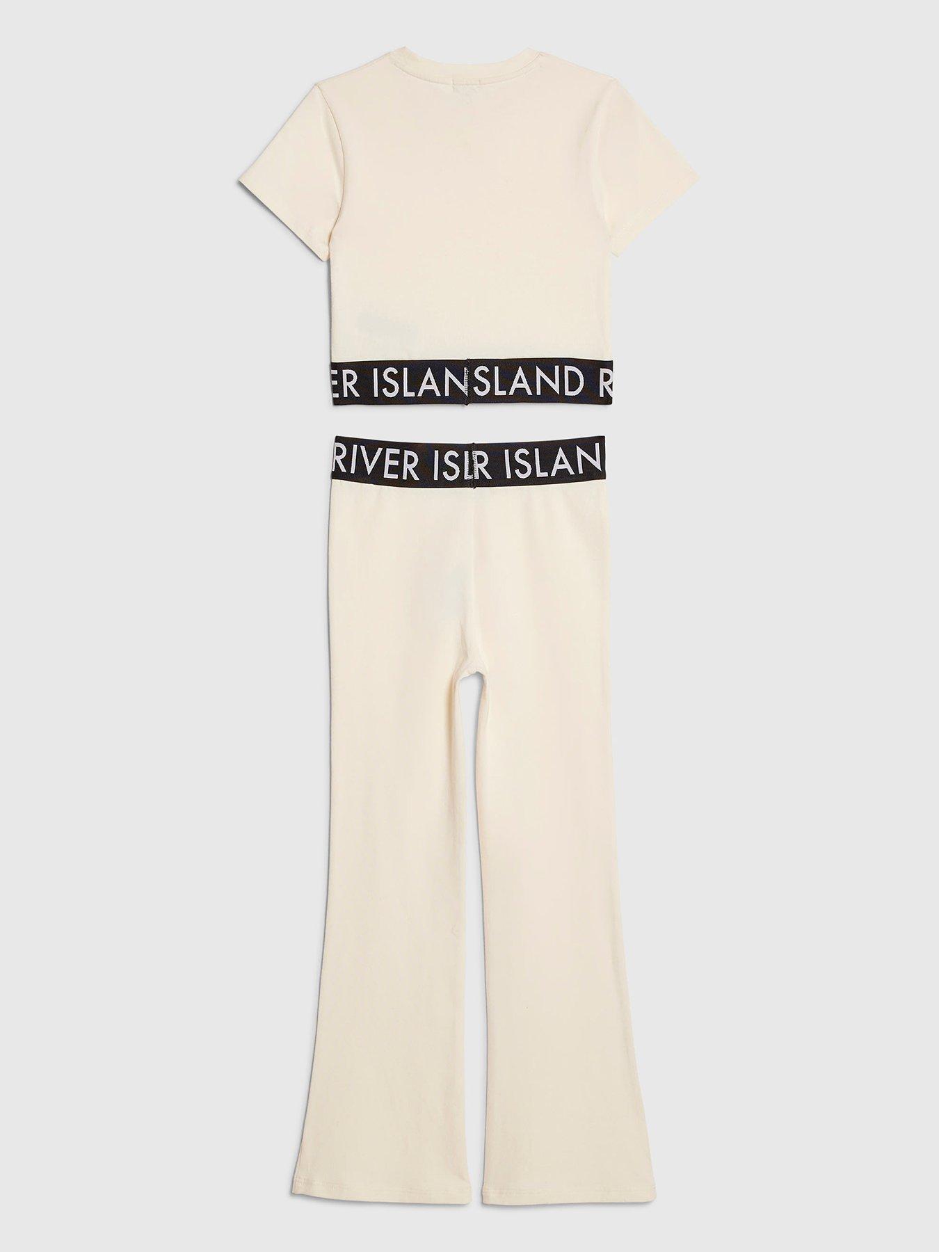 Image 2 of 4 of River Island Older Girls Branded Waistband T-Shirt And Flared Leggings Set - Cream