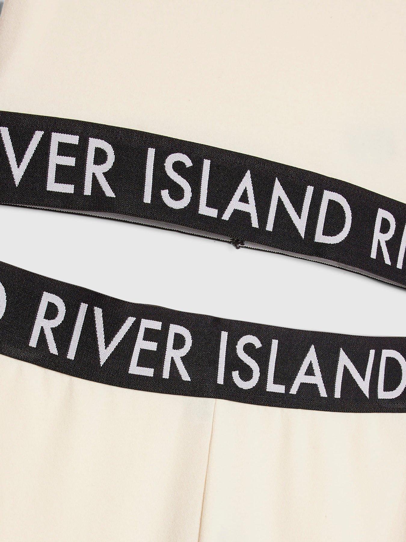 Image 3 of 4 of River Island Older Girls Branded Waistband T-Shirt And Flared Leggings Set - Cream